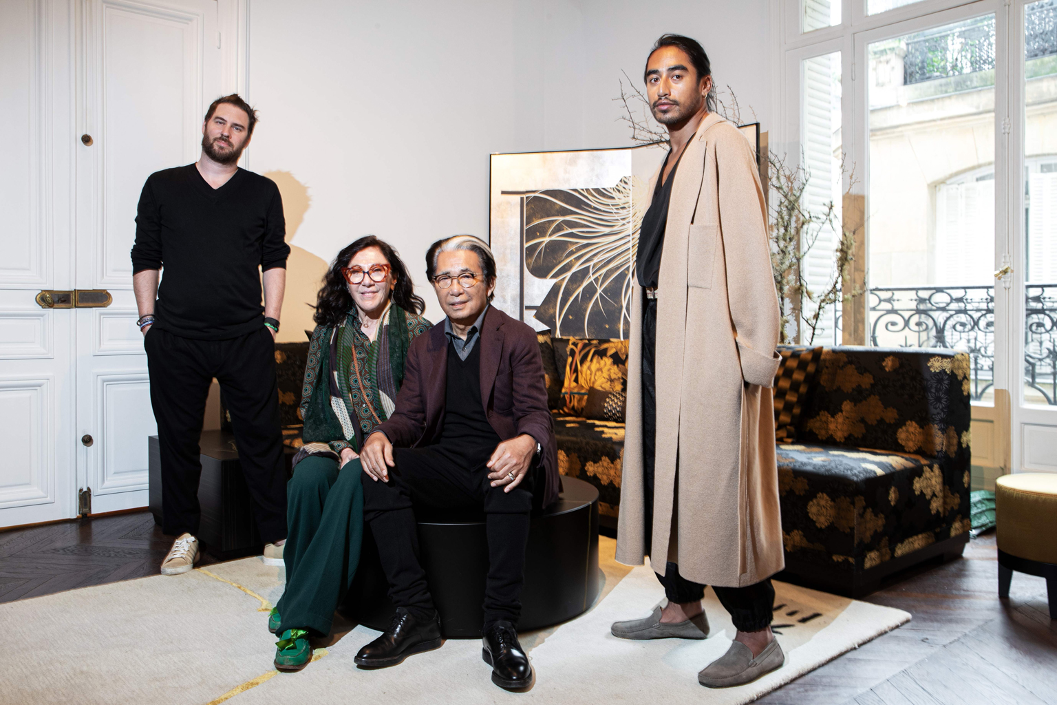 Kenzo, flanked by his assistants (from left) Jonathan Bouchet Manheim, Wanda Jelmini and Engelbert Honorat, launched K3, an interior design brand whose logo is written in Japanese with three horizontal strokes.