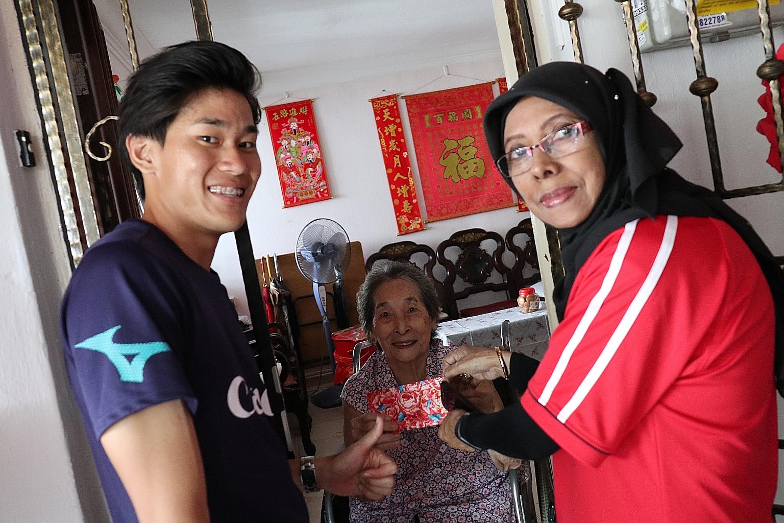Winger Daniel Goh was among the Albirex Niigata players and coaches who joined volunteers from the Yuhua community on Sunday to give out red packets containing NTUC vouchers and rice packages to 3,600 senior citizens. The package includes a 1kg pack 