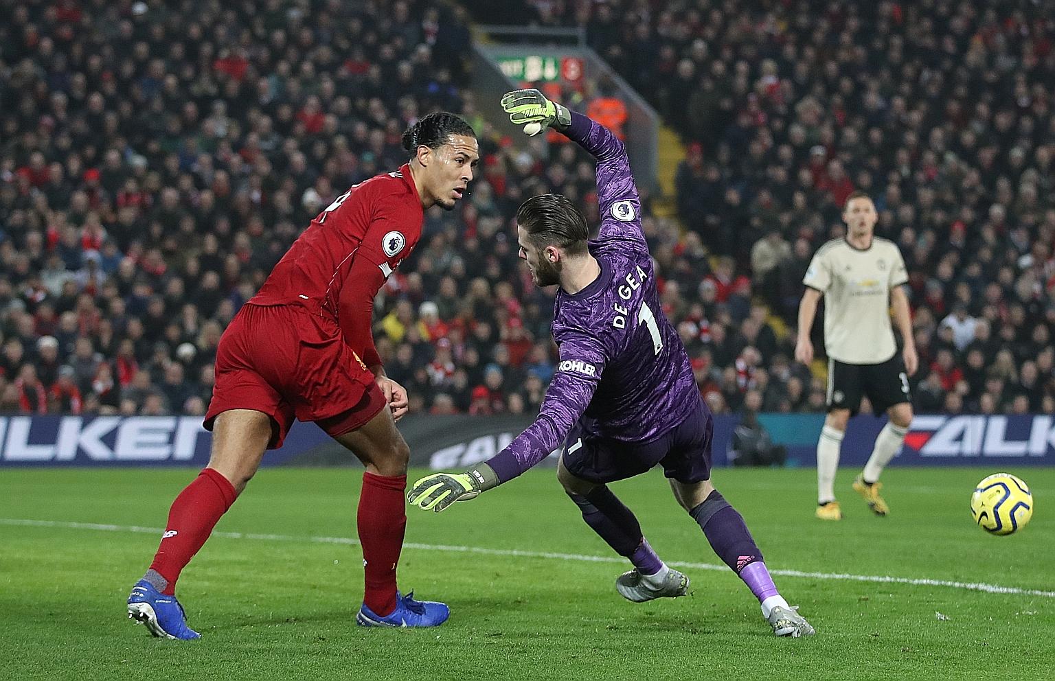 Goalkeeper David de Gea falling after a clash with Liverpool's Virgil van Dijk in Sunday's Premier League game. Referee Craig Pawson did not give a foul and Manchester United's players confronted him to protest after Roberto Firmino scored in the aft