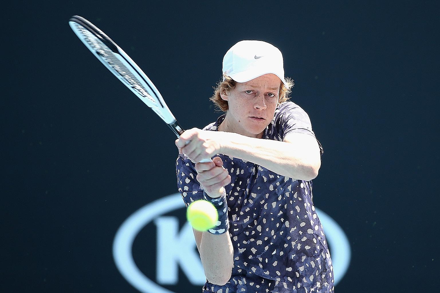 World No. 82 Jannik Sinner hitting a backhand to Max Purcell at the Australian Open. According to Roger Federer, the Italian can generate almost the same speed on forehands and backhands. PHOTO: EPA-EFE