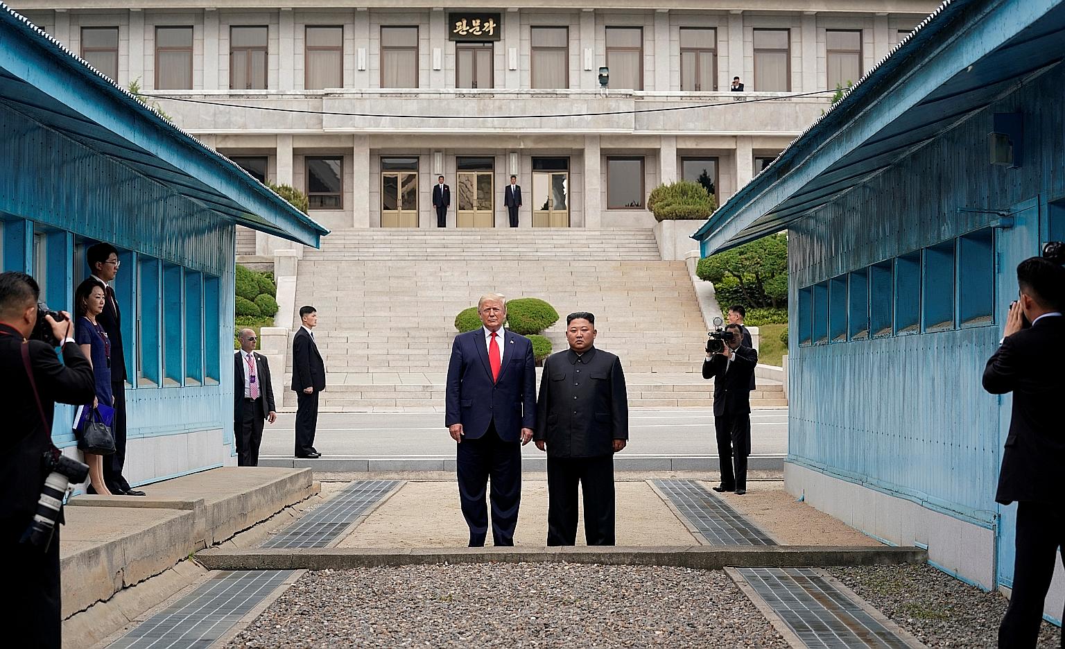 US President Donald Trump and North Korean leader Kim Jong Un in the demilitarised zone that separates the two Koreas, in Panmunjom, South Korea, last June. PHOTO: REUTERS