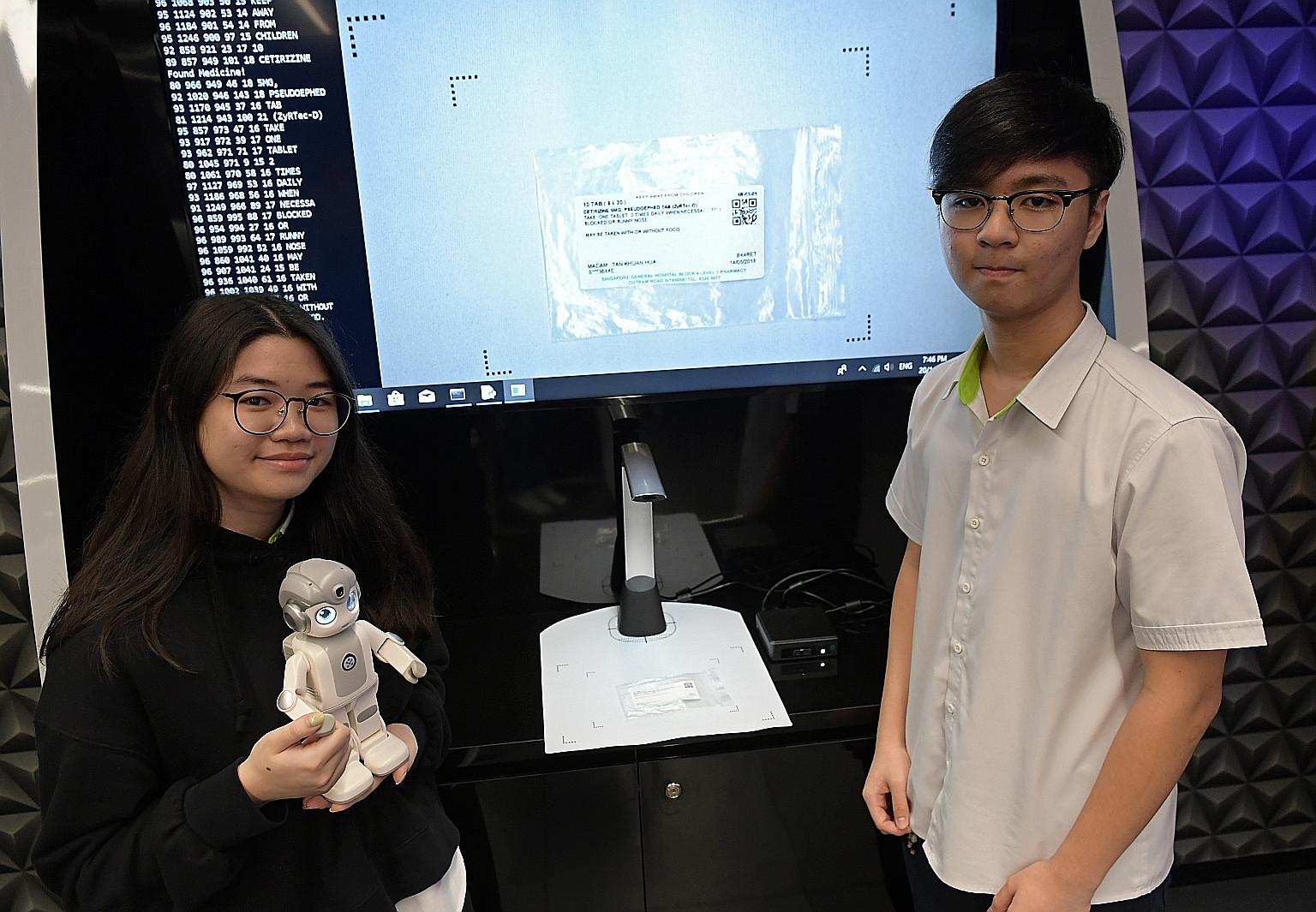 ITE students Glenda Chong and Chew Chu Xuan developed a mini robot to remind elderly persons to take their medication in a timely and correct manner. Mr Chew said he wanted to help those facing the same problem as his grandfather, who had trouble rea
