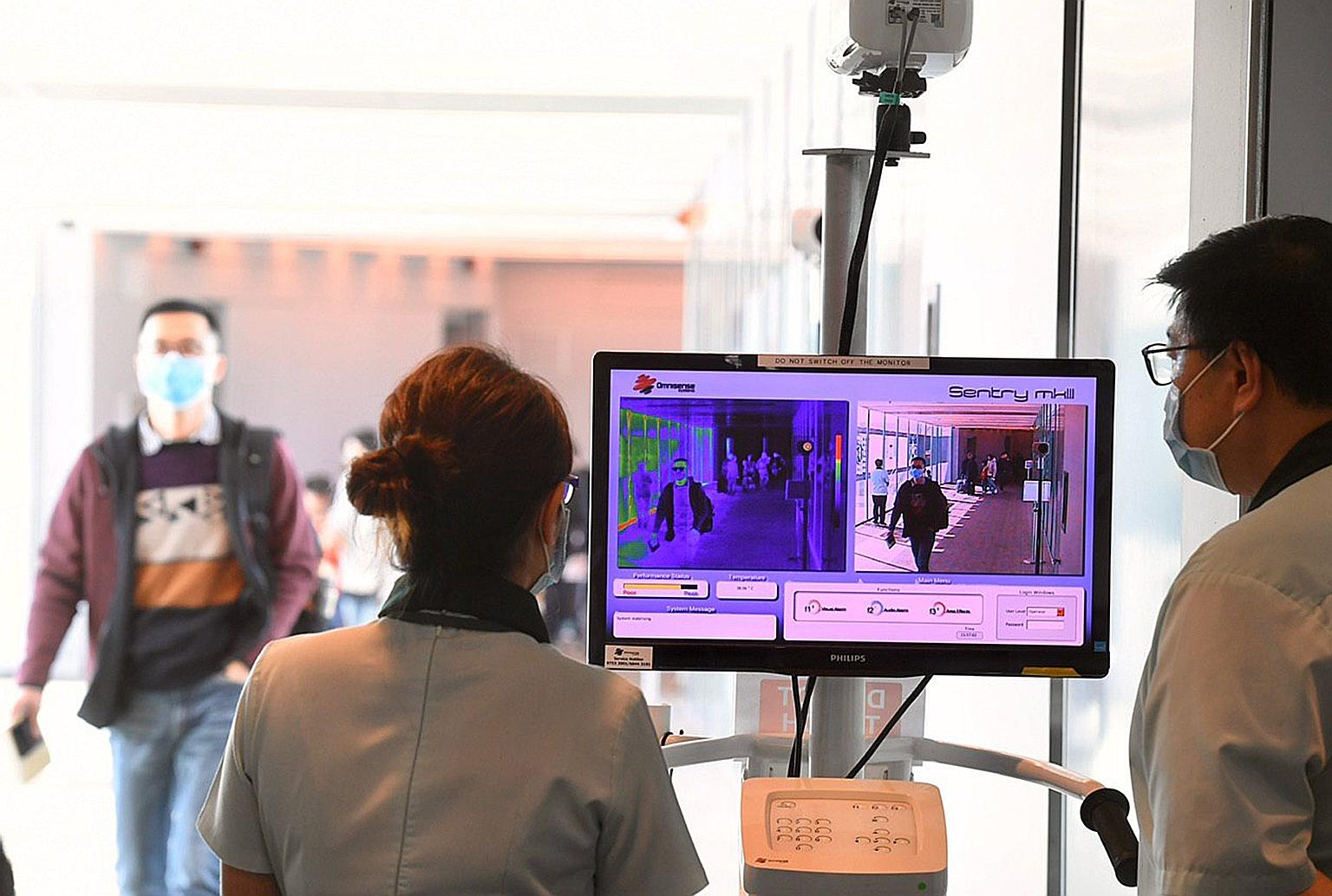 A thermal scanner in use at Changi Airport Terminal 3 yesterday. Temperature screening at the airport has been expanded to cover all inbound travellers on flights arriving from China.