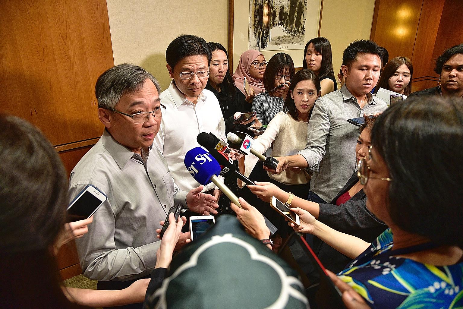 Health Minister Gan Kim Yong (left) and National Development Minister Lawrence Wong at yesterday's briefing on the Wuhan coronavirus.
