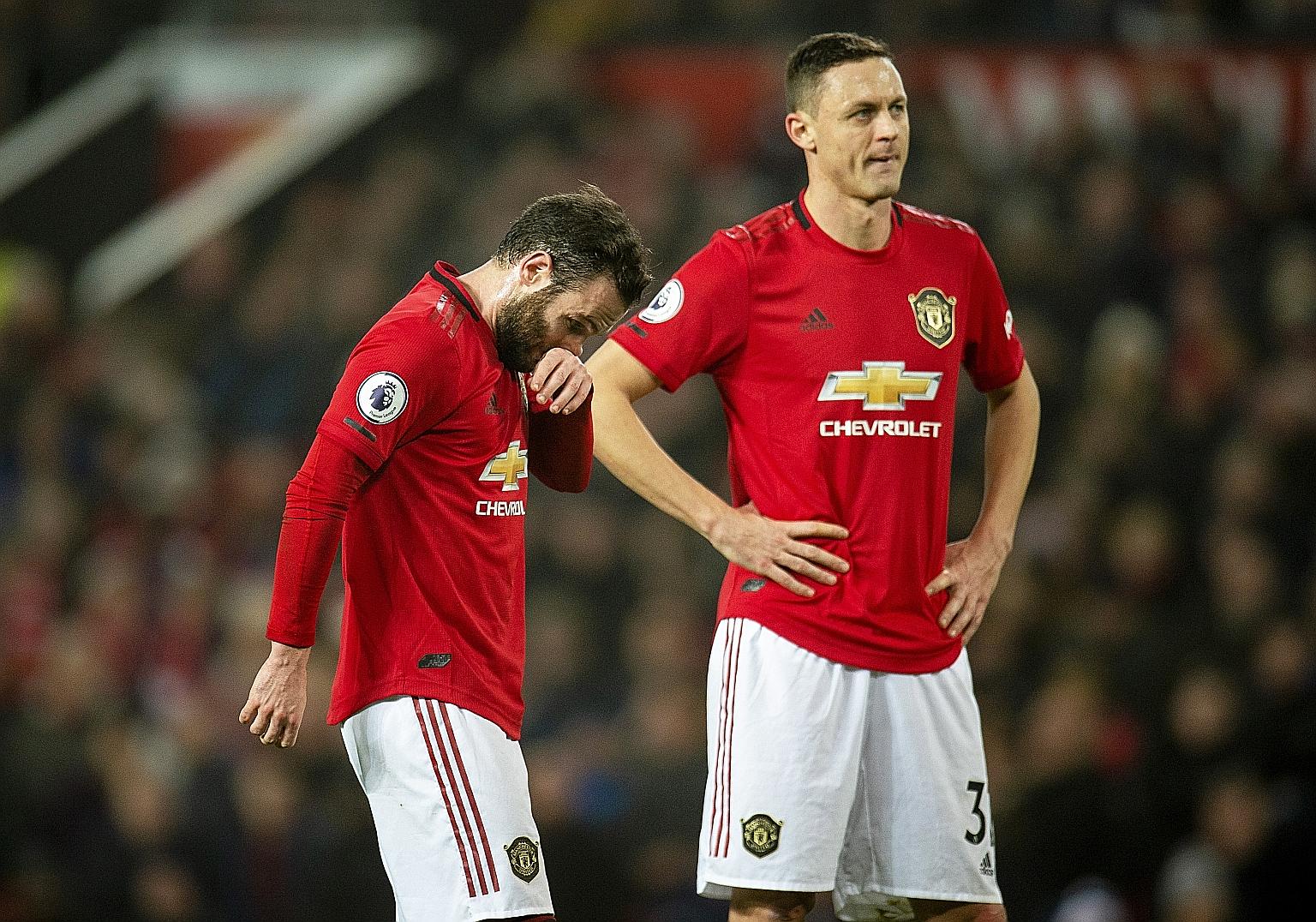 Manchester United midfielders Juan Mata (left) and Nemanja Matic are part of an underwhelming Red Devils squad experiencing their worst top-flight season in 30 years. PHOTO: EPA-EFE