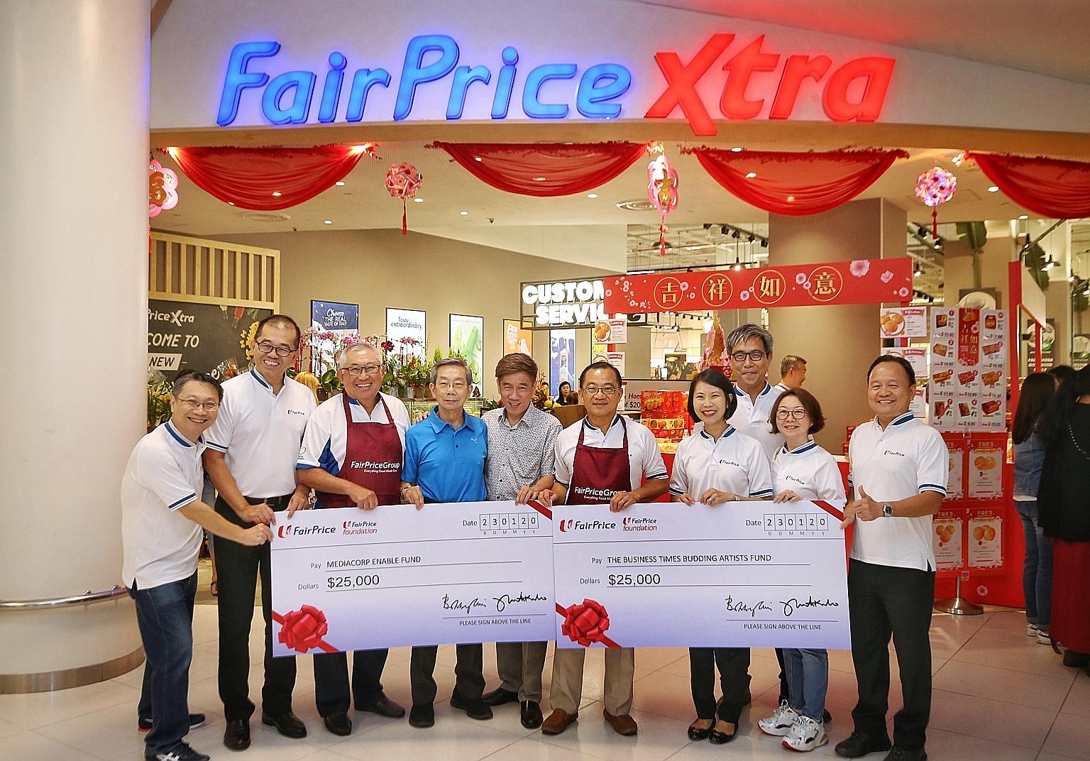 The Business Times Budding Artists Fund and the Mediacorp Enable Fund each received a $25,000 donation from NTUC FairPrice yesterday. PHOTO: LIANHE ZAOBAO