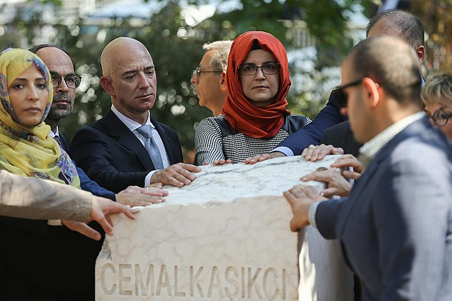 Washington Post owner Jeff Bezos on Wednesday posted a photo of himself on Twitter standing beside the late Mr Jamal Khashoggi's fiancee, Ms Hatice Cengiz, and with his hand resting on a stone bearing Mr Khashoggi's name. The caption read: "#Jamal."