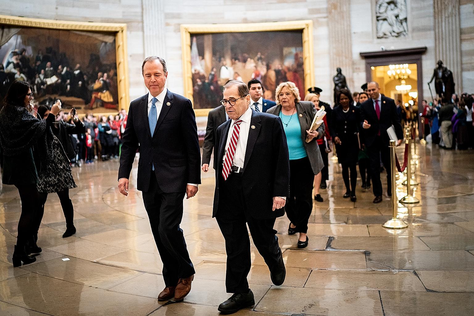 House Intelligence Committee chairman Adam Schiff (left) and House Judiciary Committee chairman Jerry Nadler leading the House impeachment managers to the Senate before the day's proceedings on Thursday. PHOTO: NYTIMES
