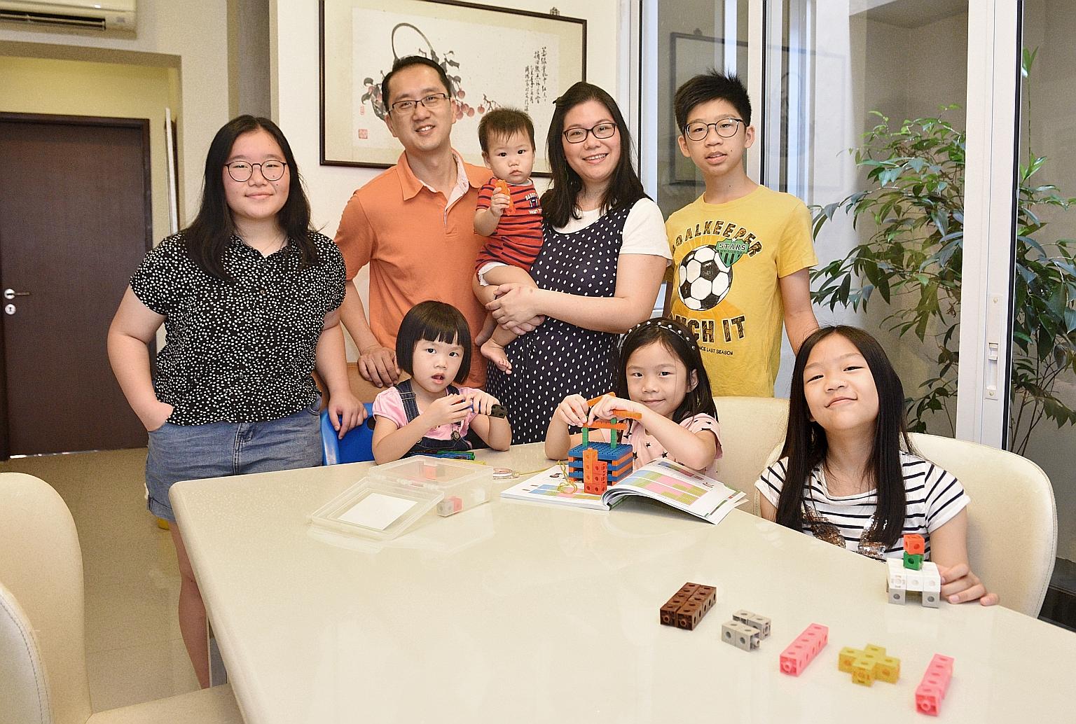 Mr Jayce Or and his wife Tracey (centre) with their six children. Charmaine (left), 15, was homeschooled before starting Secondary 1; Ryan, 13, followed in her footsteps. Faith (second from right), seven, and Emma (right), 10, are currently being hom