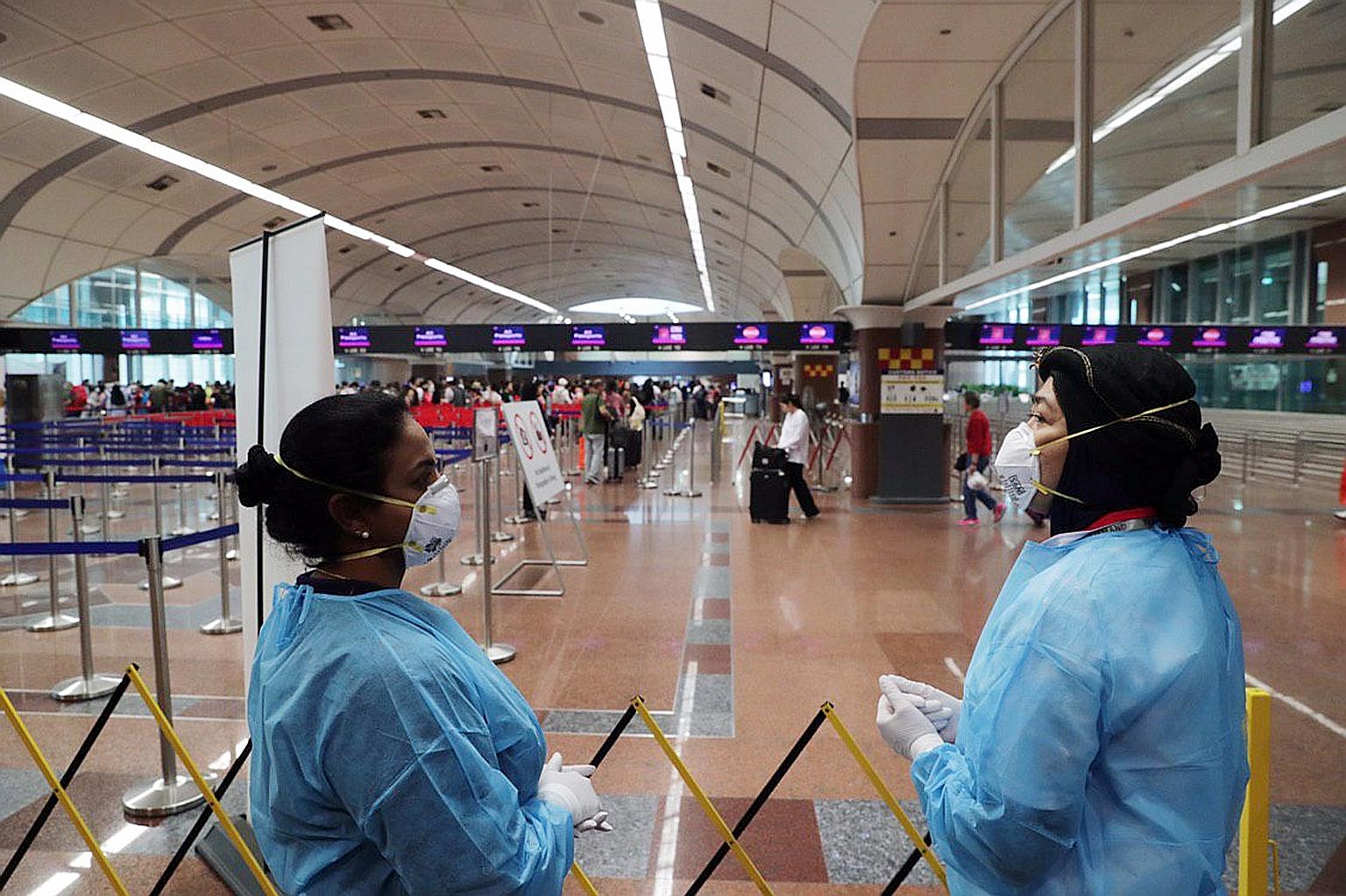 Healthcare assistants will take the temperature of travellers at Tuas (left) and Woodlands checkpoints, and suspected cases of the virus will be sent for further tests. ICA expects heavy arrival traffic from today until Tuesday, and foresees delays a