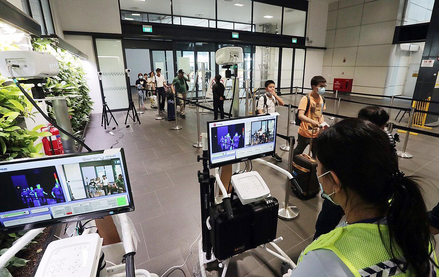 Temperature screening stations have been set up at Tuas (above) and Woodlands checkpoints. The Health Ministry stressed that all measures will be taken to contain the possible spread of the Wuhan virus. ST PHOTO: KELVIN CHNG
