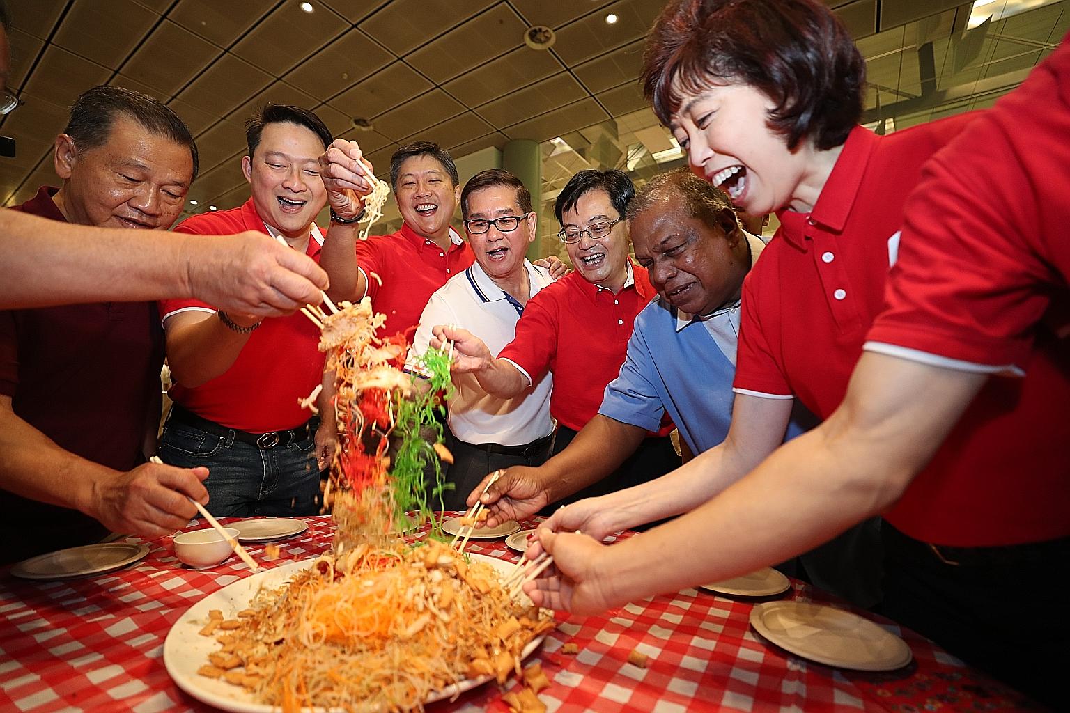 Deputy Prime Minister Heng Swee Keat, along with Senior Minister of State for Transport Lam Pin Min (second from left), NTUC secretary-general Ng Chee Meng (third from left) and NTUC president Mary Liew, taking part in a traditional lo hei session wi