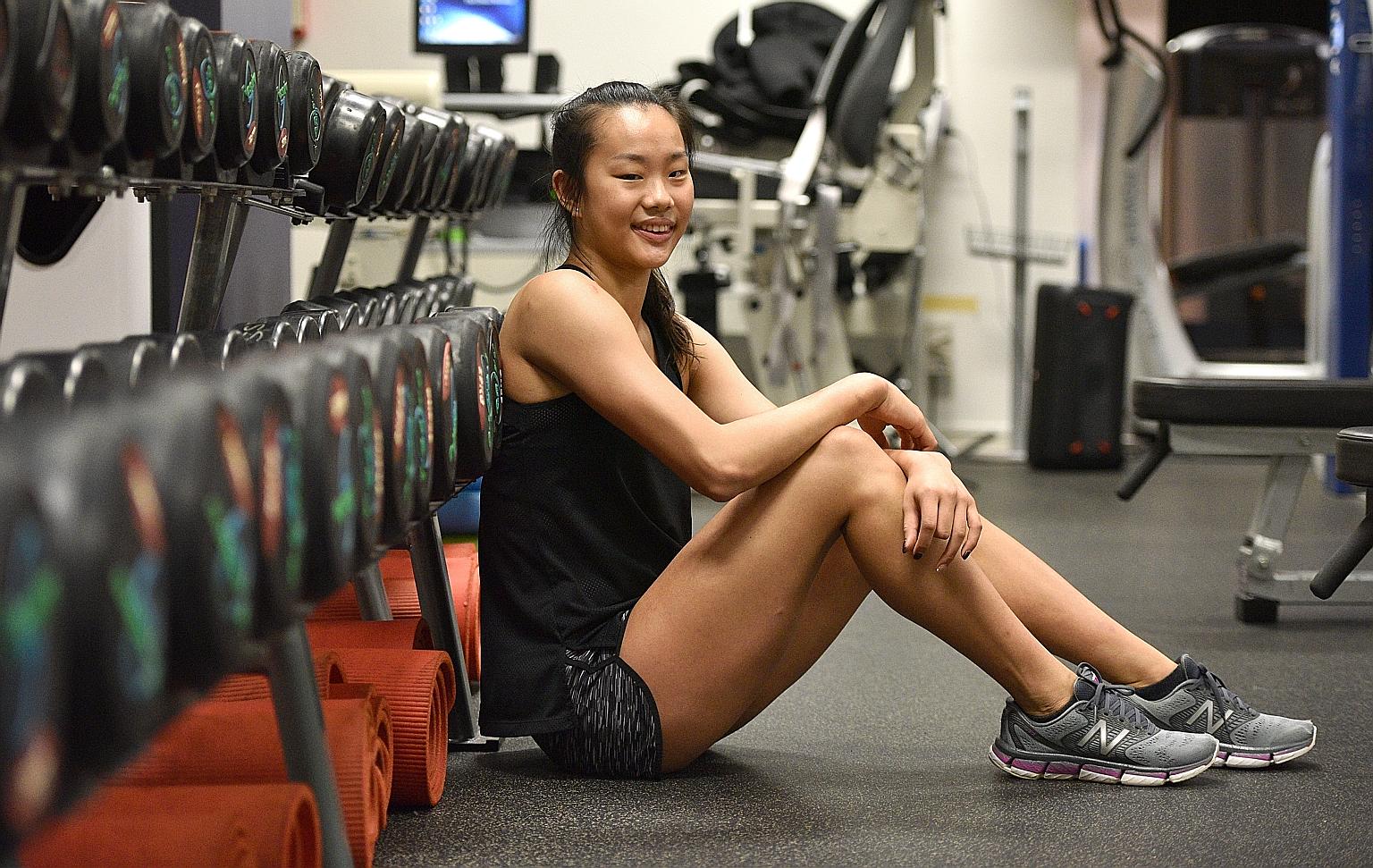 Tan Sze En, 19, at the Singapore Sport Institute gym, where she usually trains for strength and conditioning. She is less worried over physical pain than regretting if she gave up.