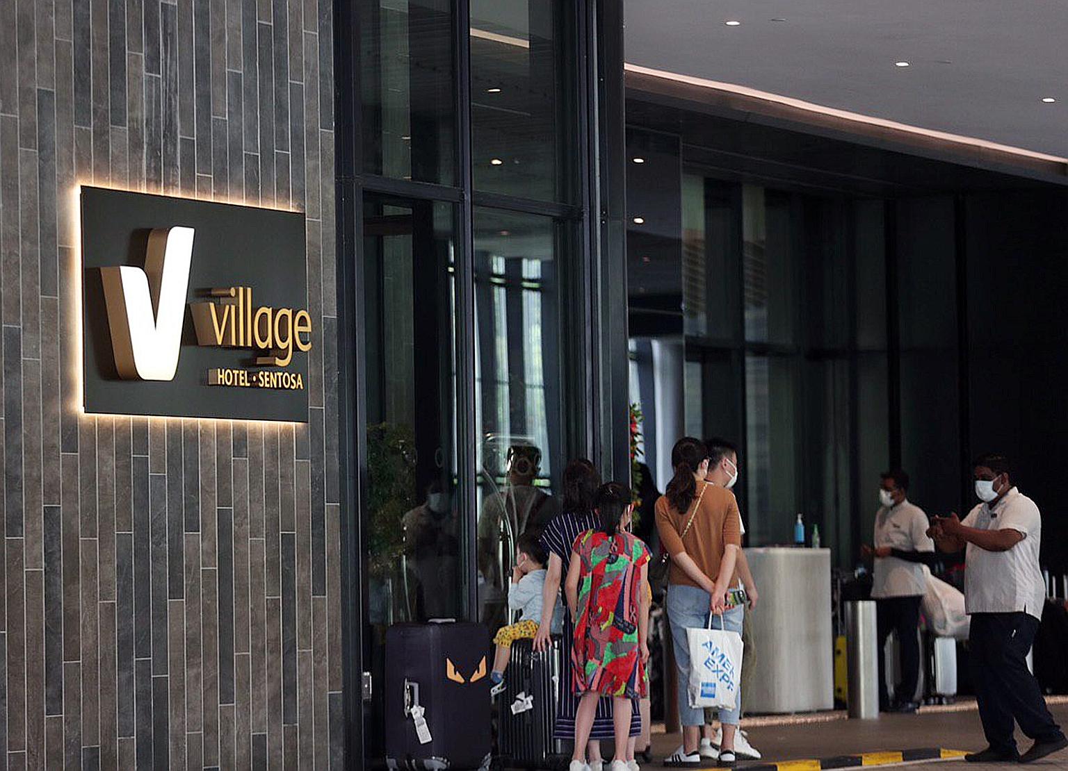 Hotel guests and staff wearing masks yesterday at Village Hotel Sentosa, where Singapore's fourth confirmed case of the Wuhan coronavirus infection - a Chinese national from Wuhan - had been staying. ST PHOTO: TIMOTHY DAVID