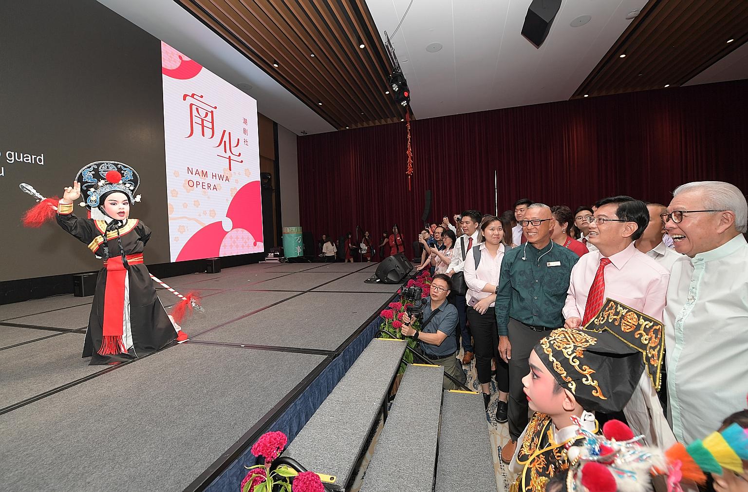 Deputy Prime Minister Heng Swee Keat watching a Teochew opera performance by five-year-old Natheo Langlet during the Chinese New Year celebration at the Singapore Chinese Cultural Centre (SCCC) yesterday. Those with him included SCCC chairman Chua Th