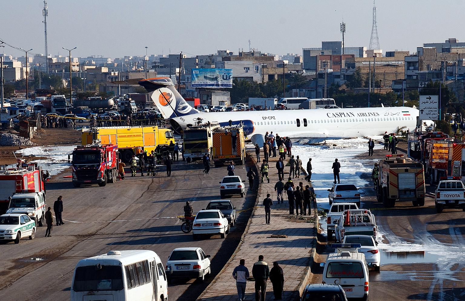 The Iranian passenger plane on a highway outside Mahshahr airport. It had skidded off the runway when trying to land yesterday. PHOTO: EPA-EFE