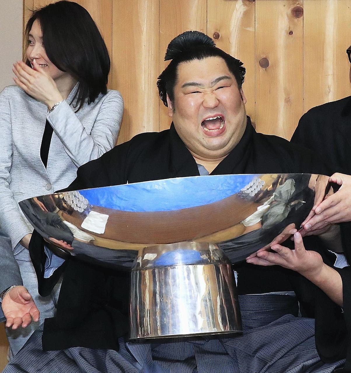 Rank-and-file wrestler Tokushoryu celebrating after winning the New Year Grand Sumo Tournament in Tokyo on Sunday, his first top-division championship.