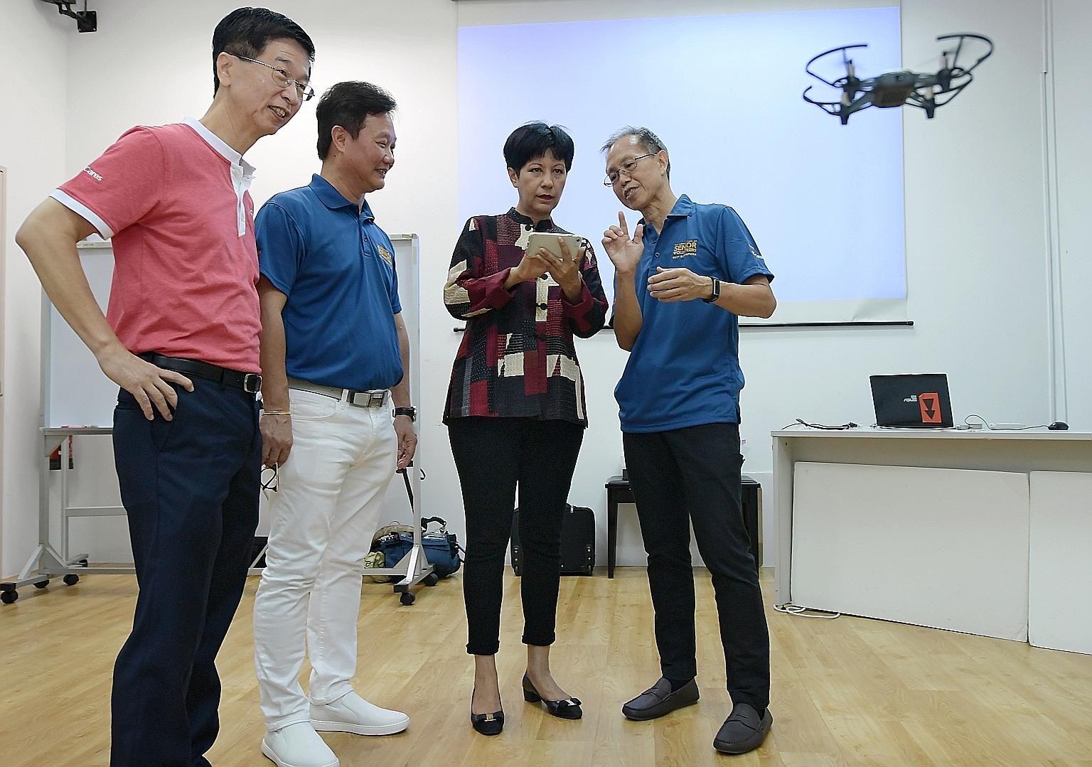 Minister in the Prime Minister's Office Indranee Rajah at a drone demonstration at RSVP Singapore yesterday. She was accompanied by (from left) Ministry of Culture, Community and Youth deputy secretary Ang Hak Seng, RSVP Singapore chairman Koh Juay M