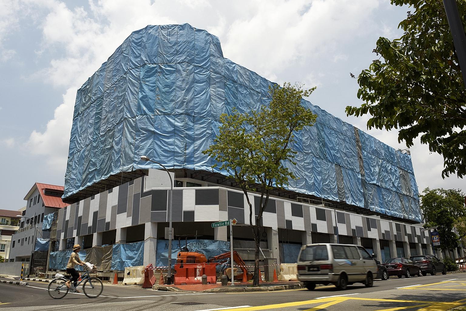 The High Court application, over the incomplete Sycamore Tree condominium in Joo Chiat, was filed to ensure that the development could continue with its construction, so that it can be handed over to the buyers. ST PHOTO: SYAZA NISRINA