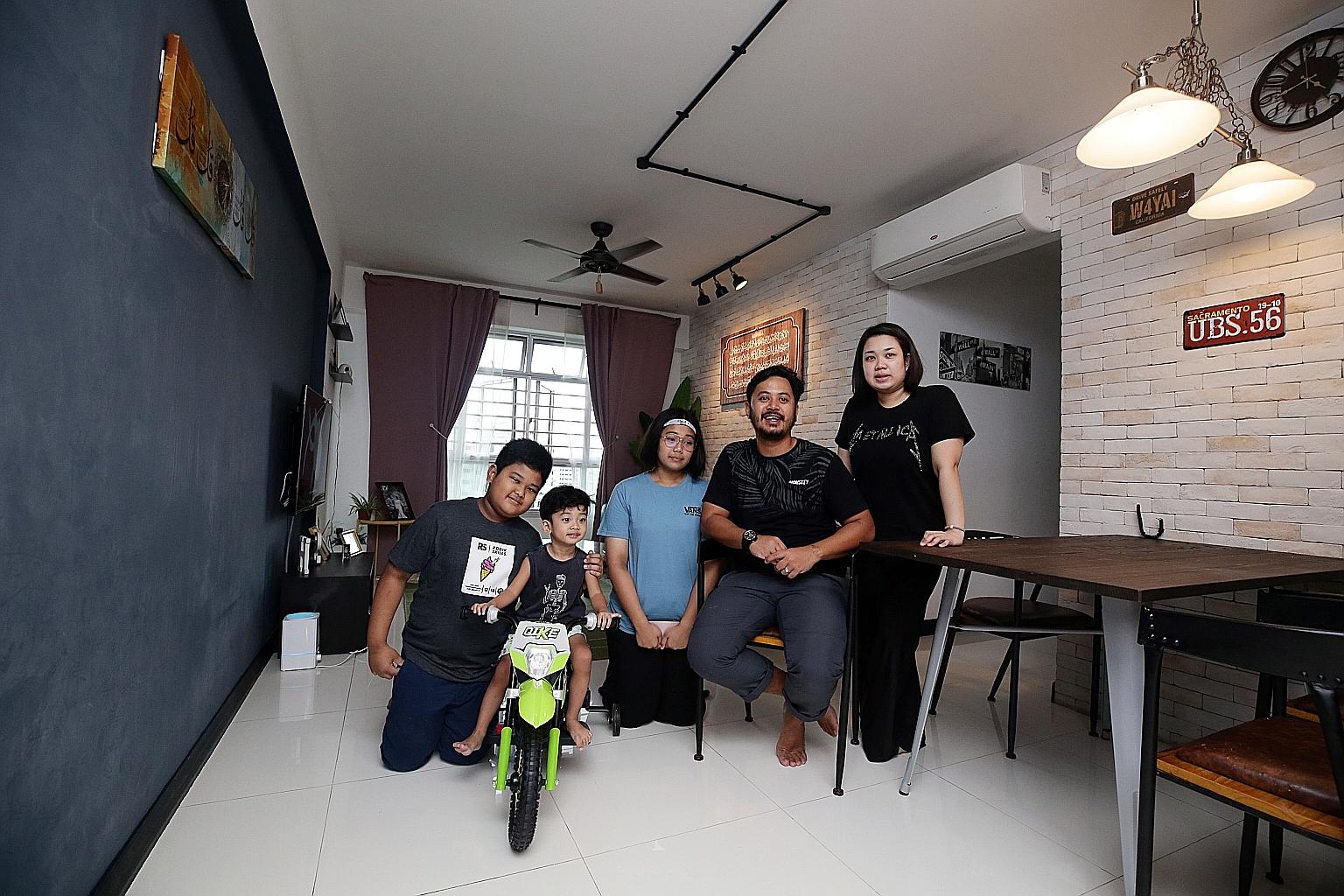 Mr Haikal Aziz, his wife Rashidah Ahmat, daughter Nur Atiqah Natasya (in blue T-shirt) and sons Md Khalish Rizqin and Md Hayyan Rizqin (on bicycle), in their four-room BTO flat in Choa Chu Kang. They are looking to upgrade to an executive flat nearby