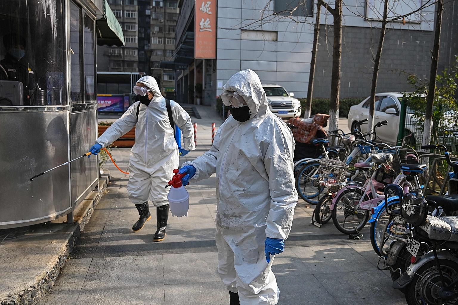 Workers disinfecting an area in Wuhan, Hubei province, on Wednesday. The public transport authorities have set up a system to deal with the spread of the virus amid the upcoming travel crunch after the week-long break.