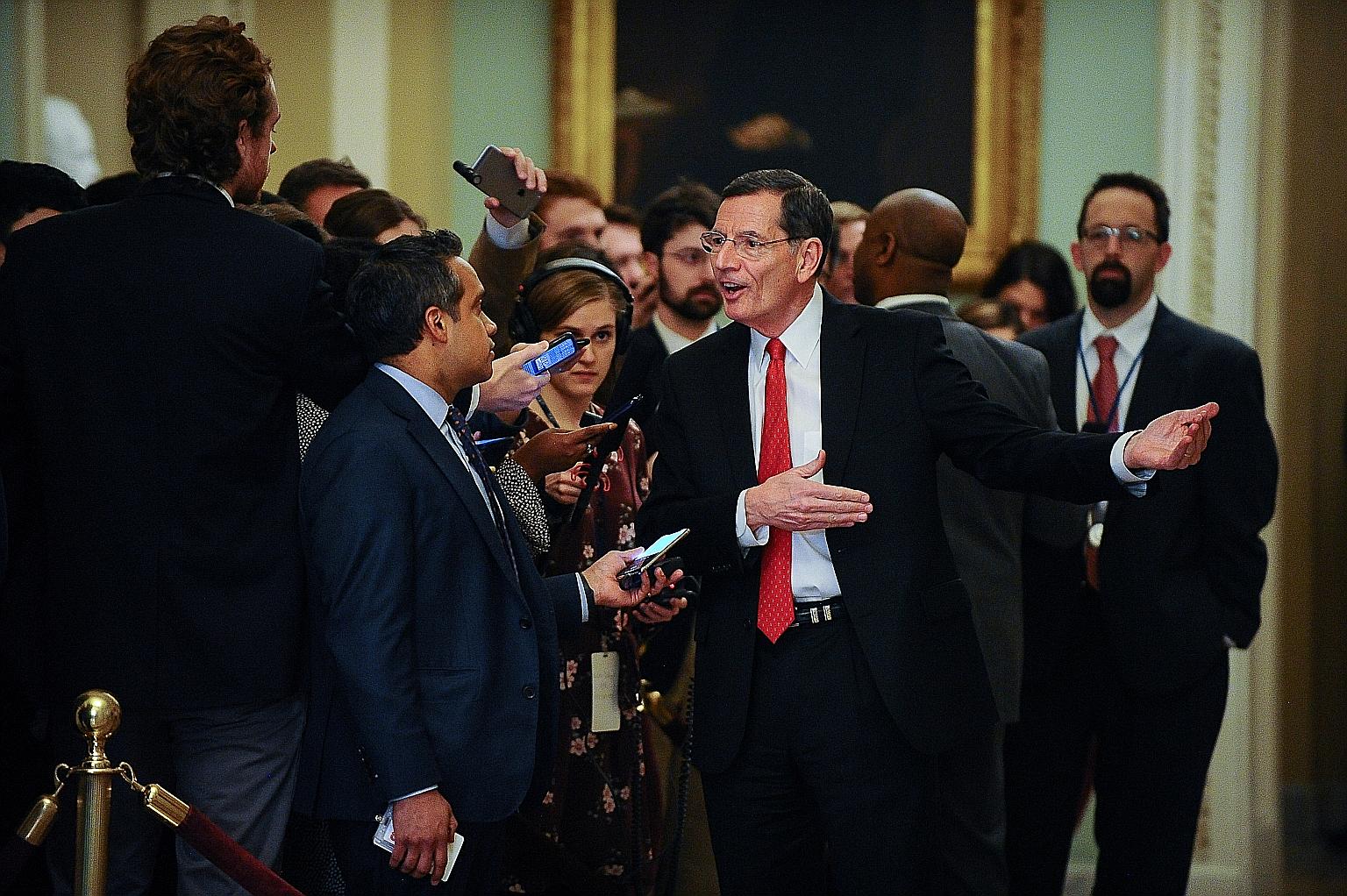Republican Senator John Barrasso speaking to the media during a brief recess at the Senate impeachment trial of US President Donald Trump in Washington on Wednesday. Democrats have sought to persuade at least four Republican senators to vote with the