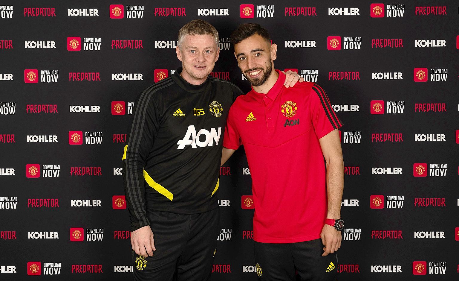 Ole Gunnar Solskjaer with Manchester United's new signing, Bruno Fernandes (right). His 51/2 year deal is worth an initial €55 million (S$82.9 million), possibly rising to €80 million with add-ons. PHOTO: TWITTER/ MANUTD