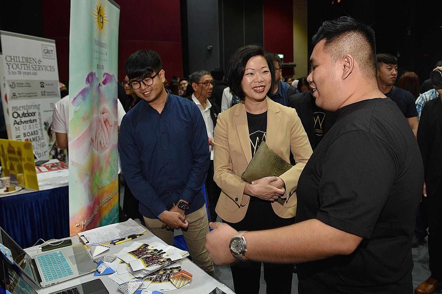 Ms Sim Ann, Senior Minister of State for Culture, Community and Youth, and Communications and Information, with Mr Sean Ravie (left) and Mr Sean Foo from Youth Guidance Outreach Services at the National Mentoring Summit yesterday.