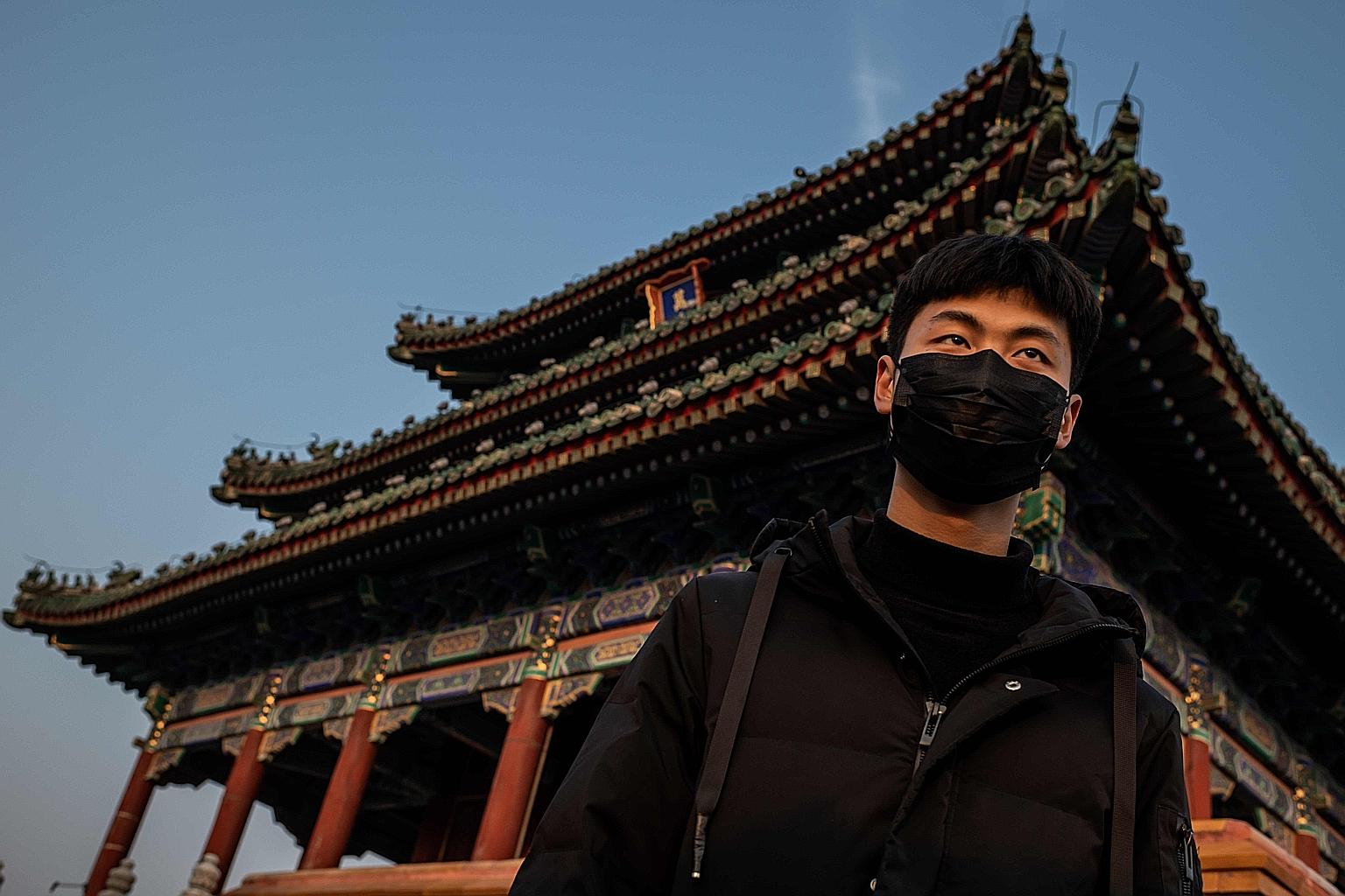 A man wearing a protective mask at Jingshan park in Beijing on Jan 25, amid the coronavirus epidemic. Critics have blamed the contagion on a lack of transparency, a slow start to quarantining suspected carriers and officials initially playing down, i