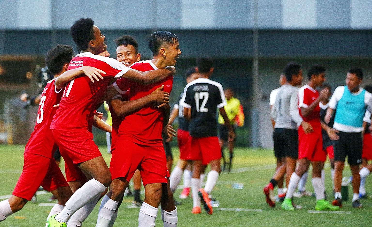 Singapore Sports School players (in red) celebrating on the way to beating Meridian Secondary School in the National School Games B Division final in April 2018. The sports school has won the B Division title eight times since 2007, and its recent 32