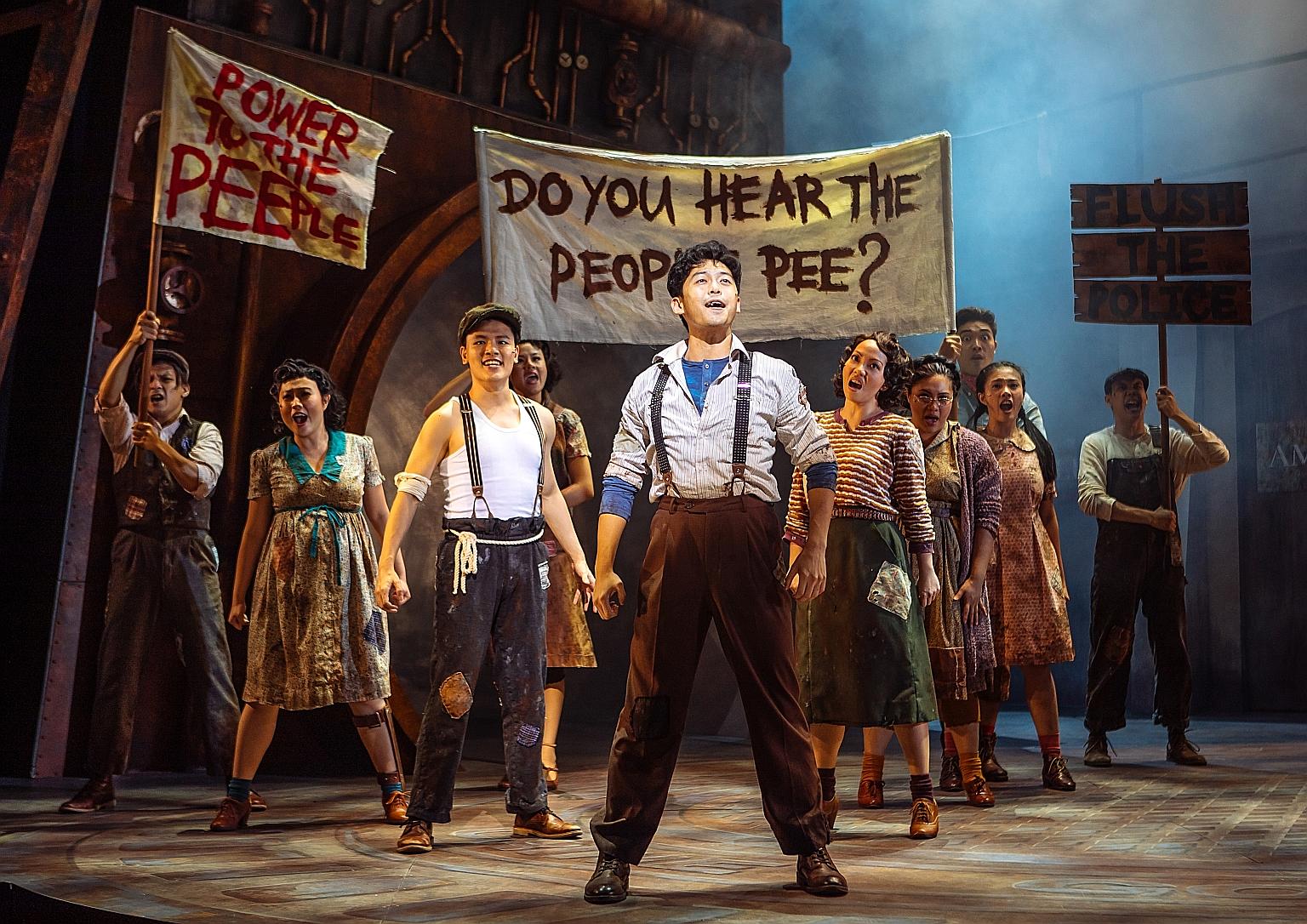 Actor Benjamin Chow (foreground) stars in Urinetown: The Musical, which poked fun at topics such as populism, corporate corruption and musicals themselves.