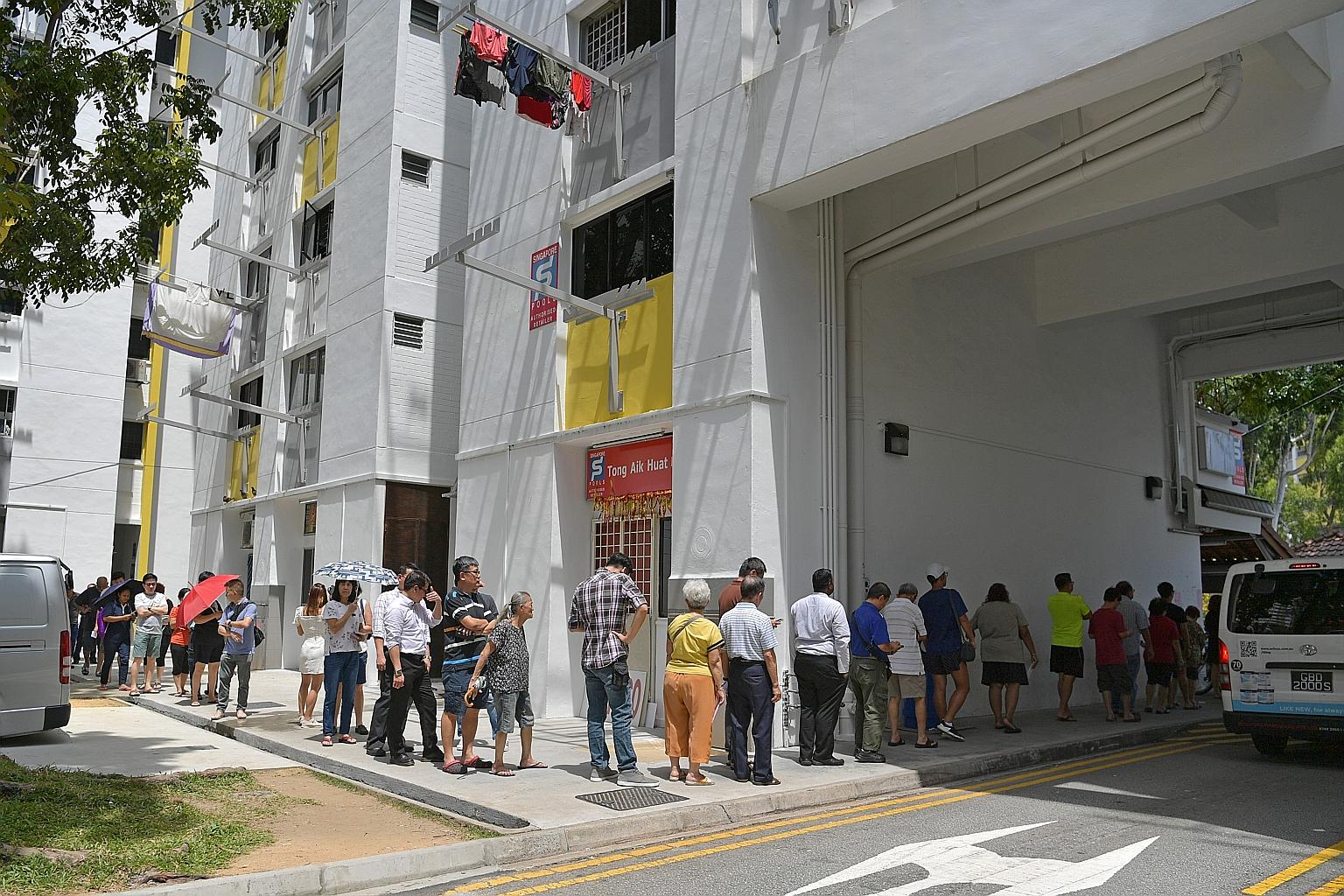 The searing afternoon heat could not stop these people from queueing up yesterday afternoon for their shot at a $12 million prize pool for this year's Toto Hong Bao Draw. By 2pm, the queue outside Tong Aik Huat, a popular Singapore Pools authorised o