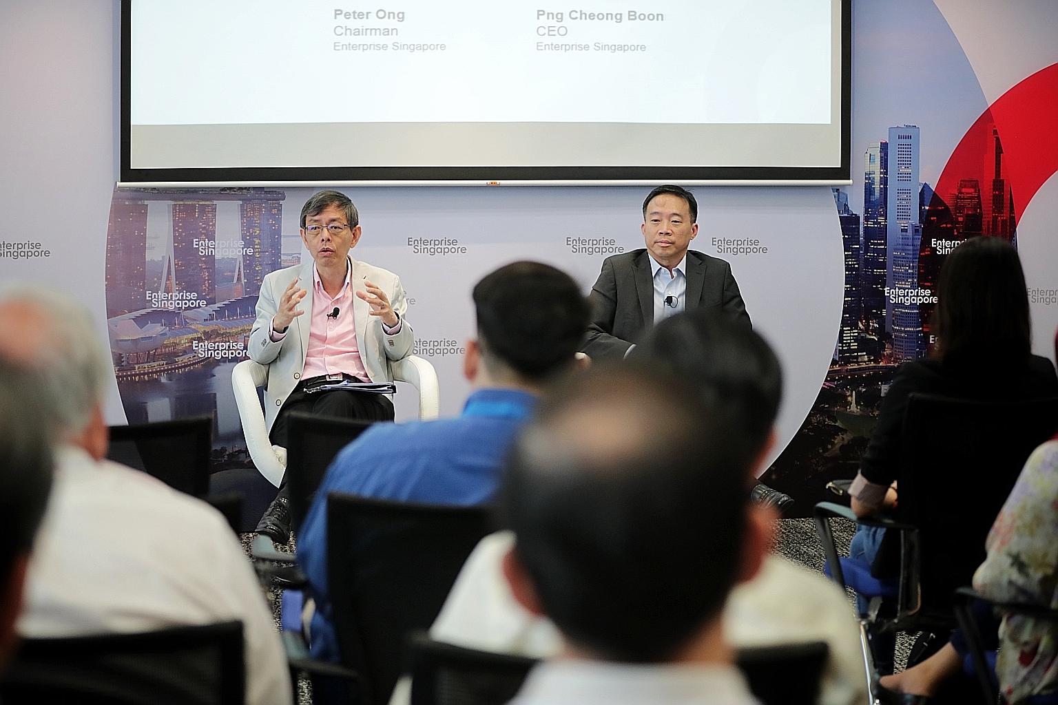 At Enterprise Singapore's year-in-review discussion yesterday, chairman Peter Ong (left) and chief executive Png Cheong Boon said businesses must sustain their innovation and productivity drives during this trying period.
