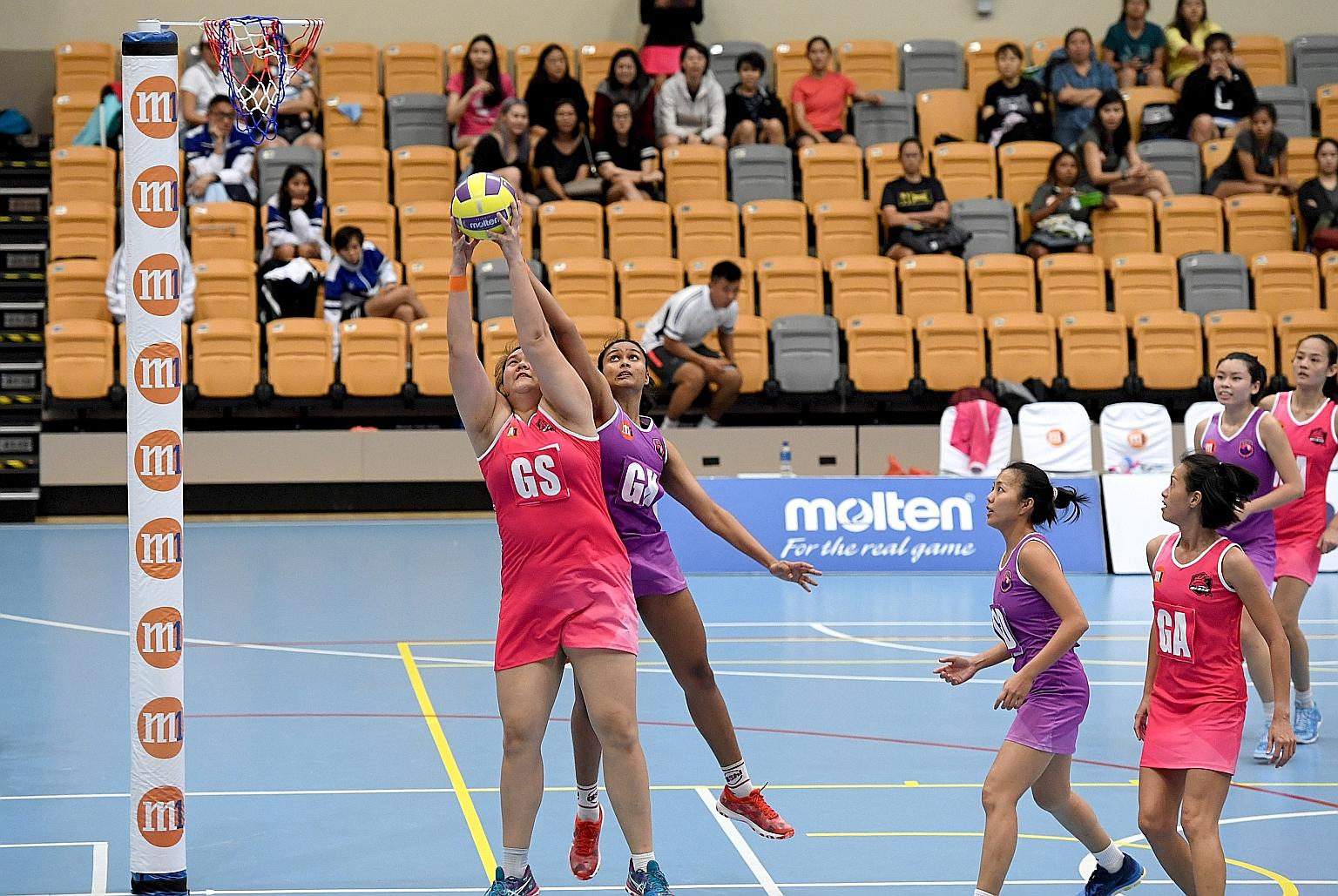 Young players like Lee Pei Shan, 20, (left, fighting for the ball with Reena Divya Manogaran of Sneakers Stingrays in last season's opener) will shoulder a heavier responsibility in Blaze Dolphins' M1 Netball Super League campaign starting today.