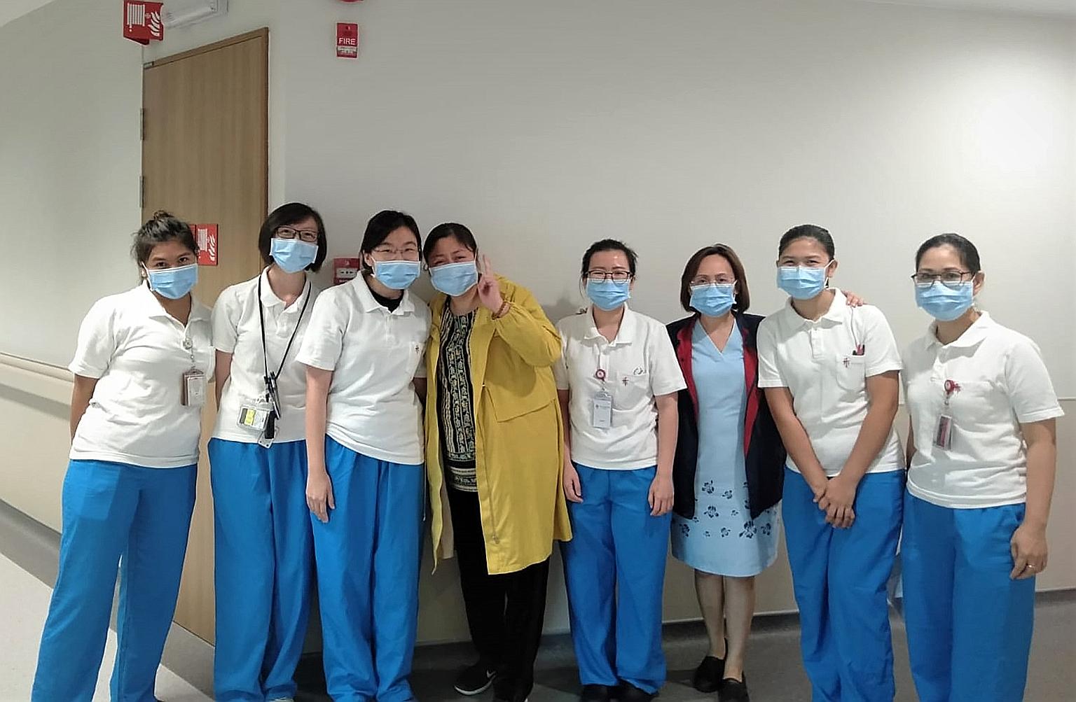 Ms Jiang (fourth from left), diagnosed with the coronavirus infection after arriving in Singapore for a holiday, posing for a photo with doctors and nurses at the National Centre for Infectious Diseases to thank them for caring for her when she was w