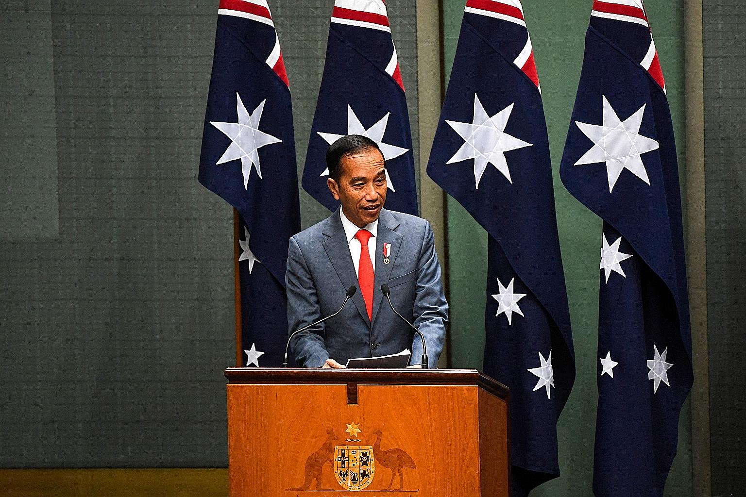 President Joko Widodo addressing the Australian Parliament yesterday, when he outlined a range of areas of potential collaboration with Australia. PHOTO: AGENCE FRANCE-PRESSE