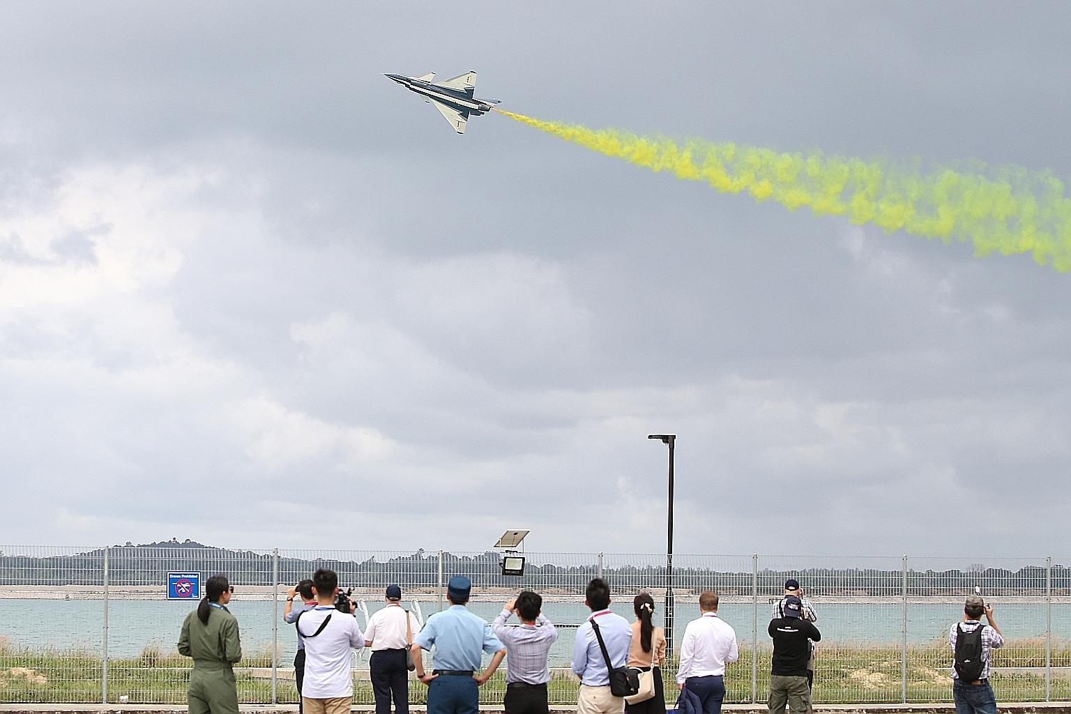 A solo aerial display by The Ba Yi Aerobatics Team from China's People's Liberation Army Air Force at the Singapore Airshow yesterday.