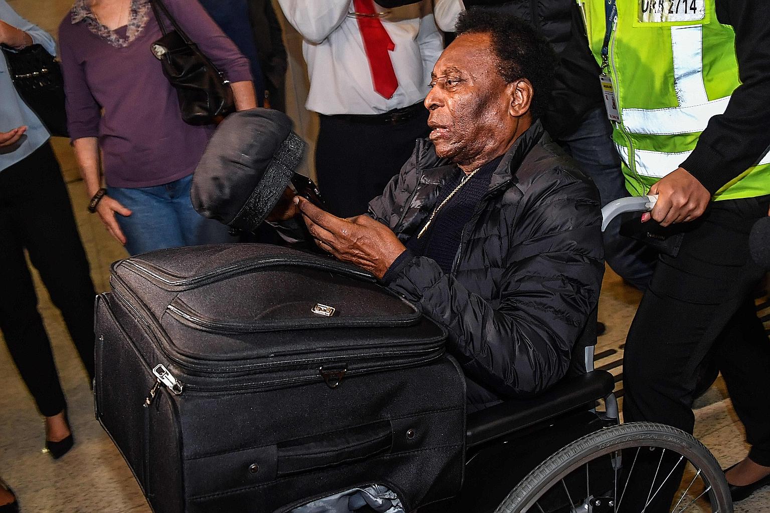 Pele, seen at the Guarulhos International Airport near Sao Paulo last year, is reliant on a walker these days, with the 79-year-old Brazilian's health beginning to take a toll on him. PHOTO: AGENCE FRANCE-PRESSE