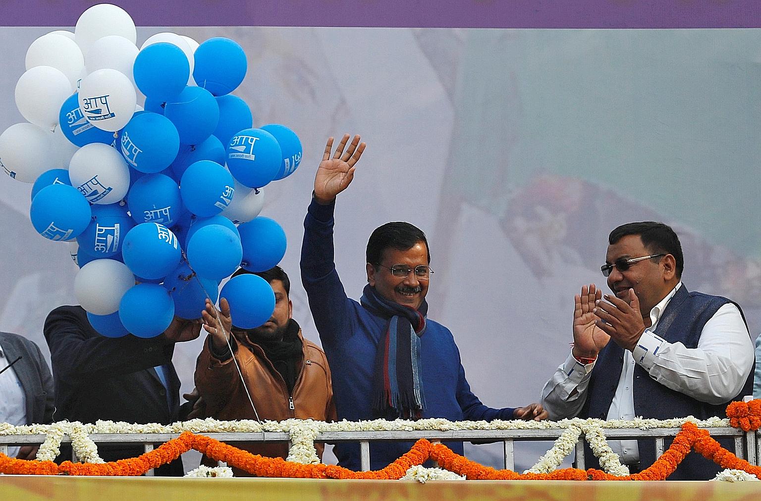 Delhi Chief Minister and leader of seven-year-old Aam Aadmi Party Arvind Kejriwal waving to his supporters during celebrations at the party headquarters in New Delhi, India, yesterday. PHOTO: REUTERS