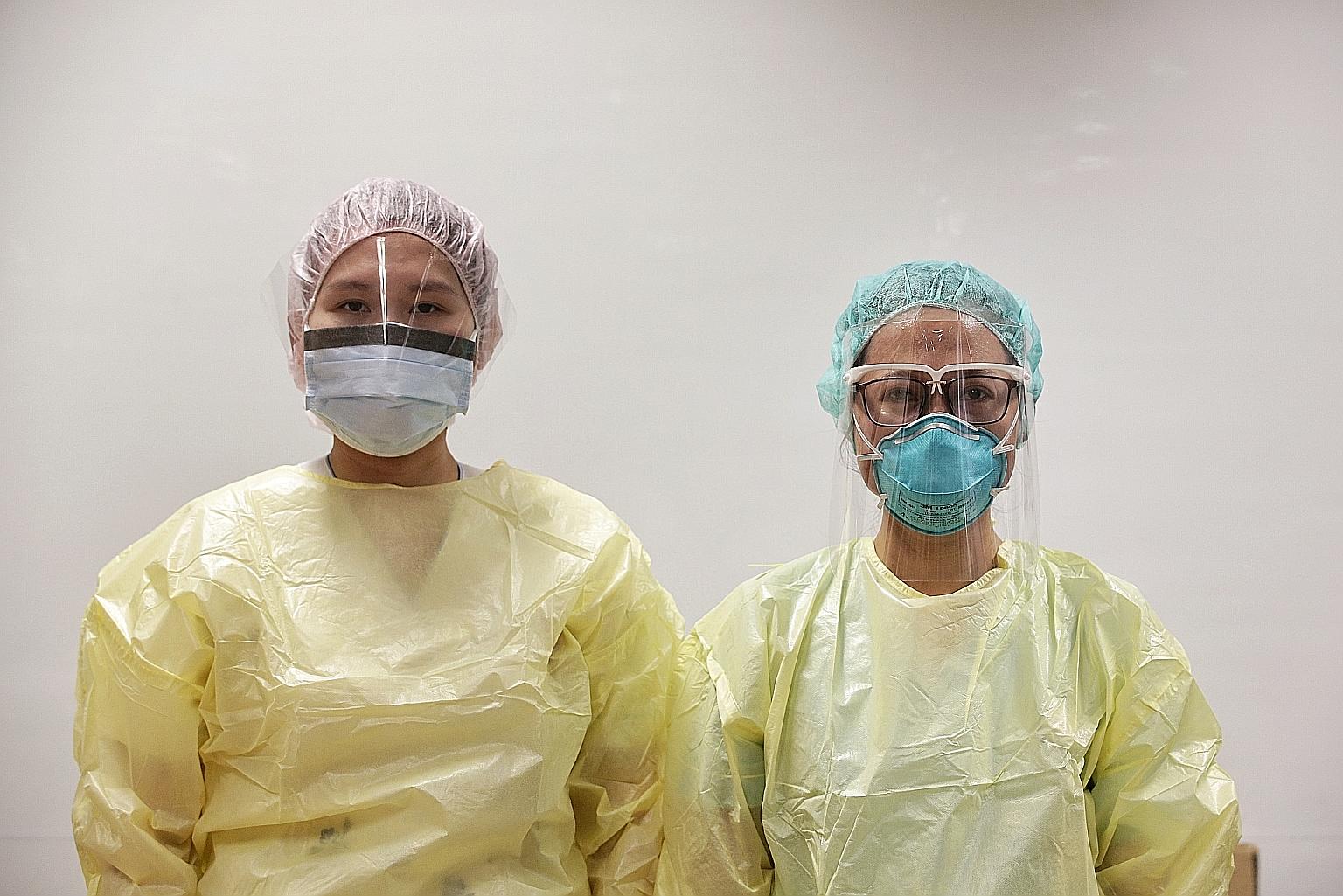 A nurse (right) donning the new face shield prototype which comes with a frame that leverages 3D-printing technology, while another wears the face visor that healthcare staff can currently opt for in lieu of wearing protective goggles. ST PHOTO: KEVI