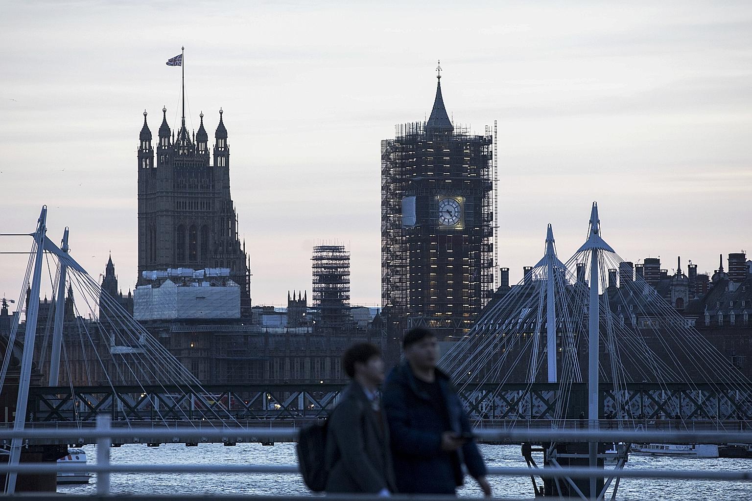 Pedestrians crossing Waterloo Bridge against a backdrop of the Palace of Westminster and the Big Ben clock tower in London. The cost of renovating Elizabeth Tower, which houses the famous clock, has increased by millions of pounds after the discovery