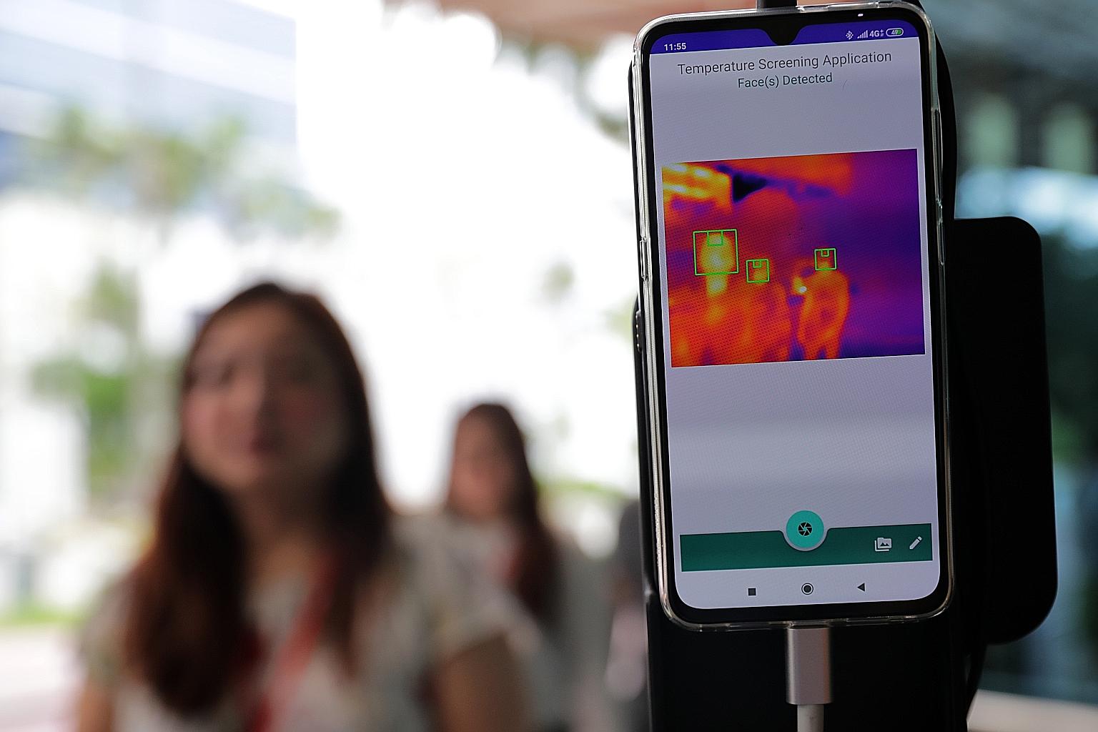 The real-time screening device, which uses a smartphone fitted with thermal and 3D laser cameras, detects the forehead temperature of individuals walking by, even if they are wearing spectacles, surgical masks or headgear.