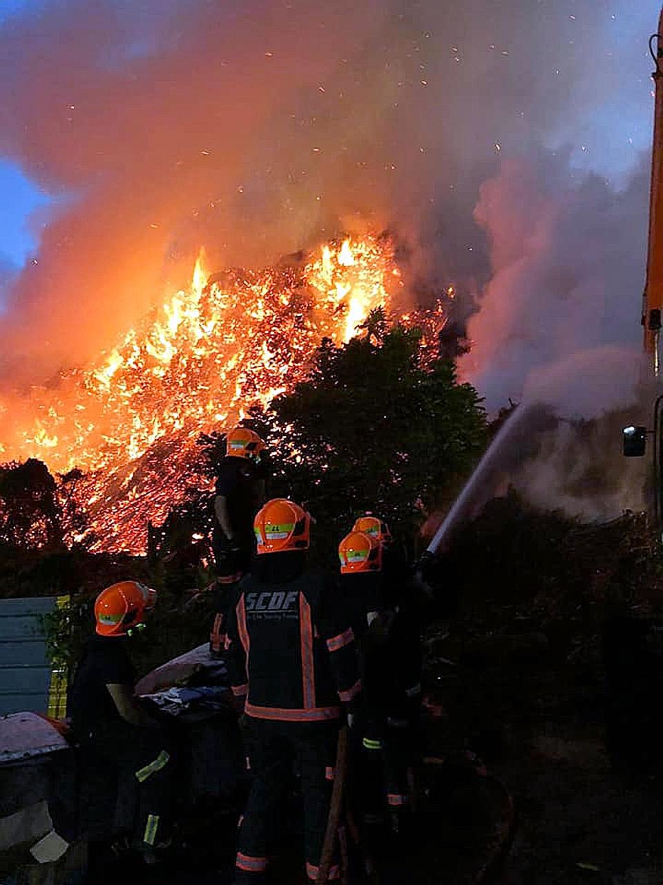 The Singapore Civil Defence Force putting out a fire at 131 Lorong Semangka yesterday.