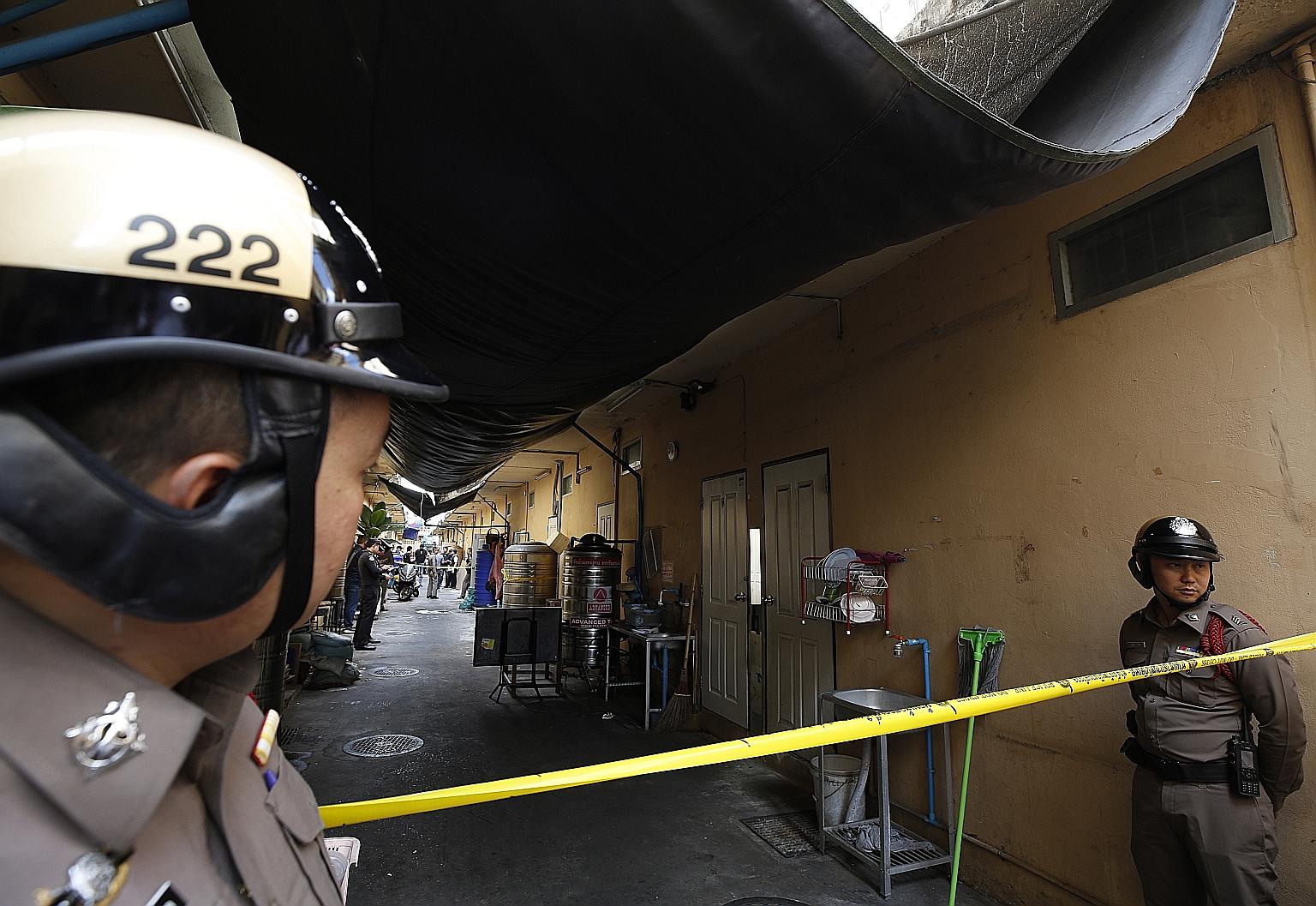 The site of the shooting in Bangkok yesterday. The man was identified as the owner of a shop selling sports gear in an area near tourist hot spots such as MBK Centre and Siam Paragon. He has been charged with carrying firearms in public and opening f