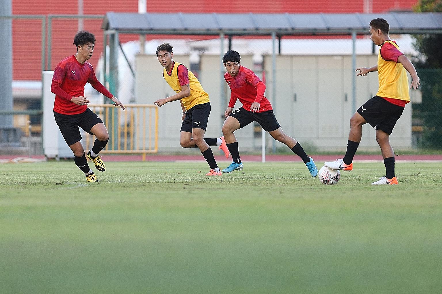 Singapore internationals Gabriel Quak (second from left) and Ho Wai Loon (second from right) during Sailors' training on Thursday. The well-heeled side will be hot title favourites for the upcoming season. 