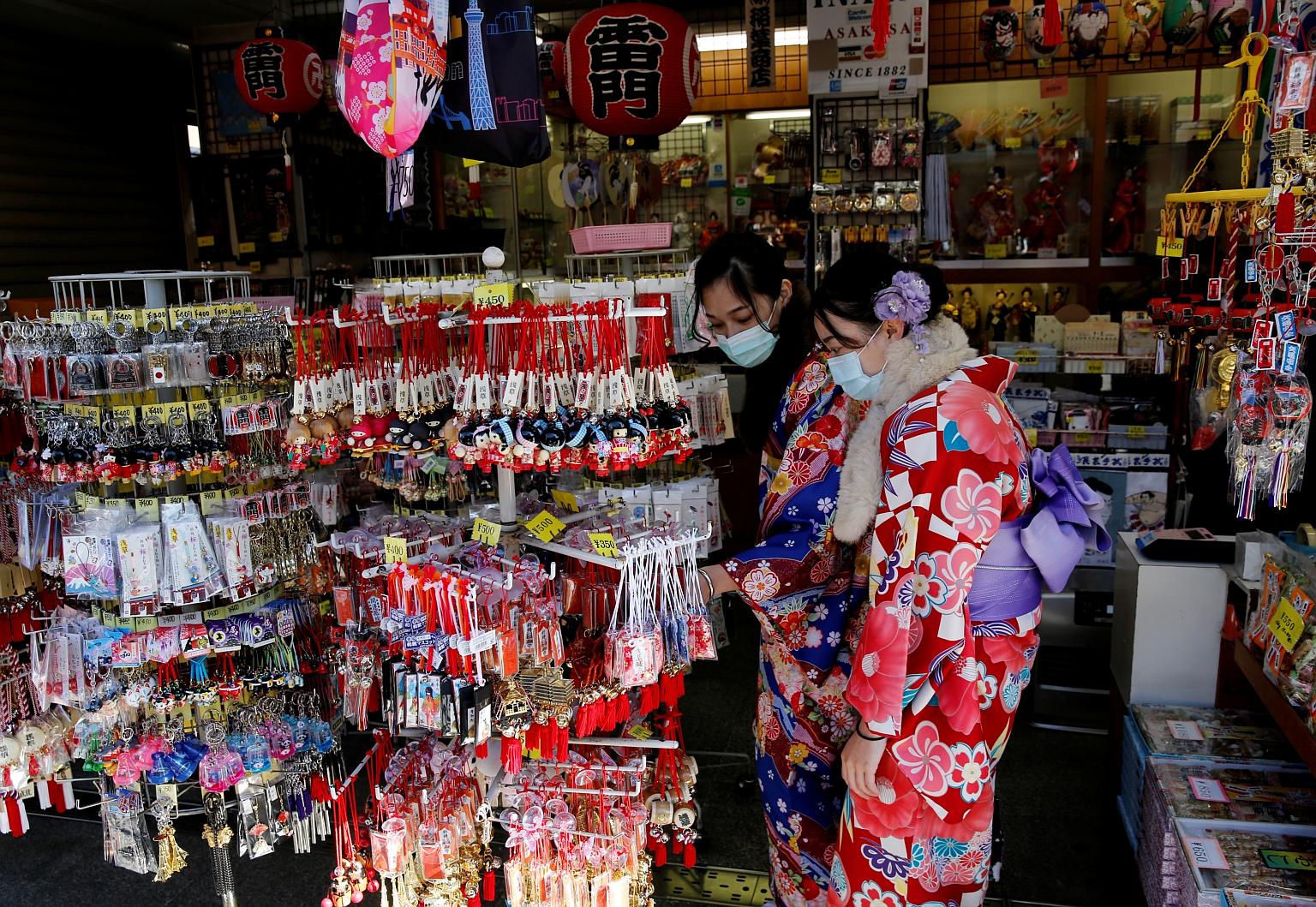 Tourists in kimonos at a souvenir shop in Tokyo late last month. Japan is expecting its biggest economic contraction since 2014 for the October-December quarter last year, and some analysts expect its economy to suffer another contraction in the curr