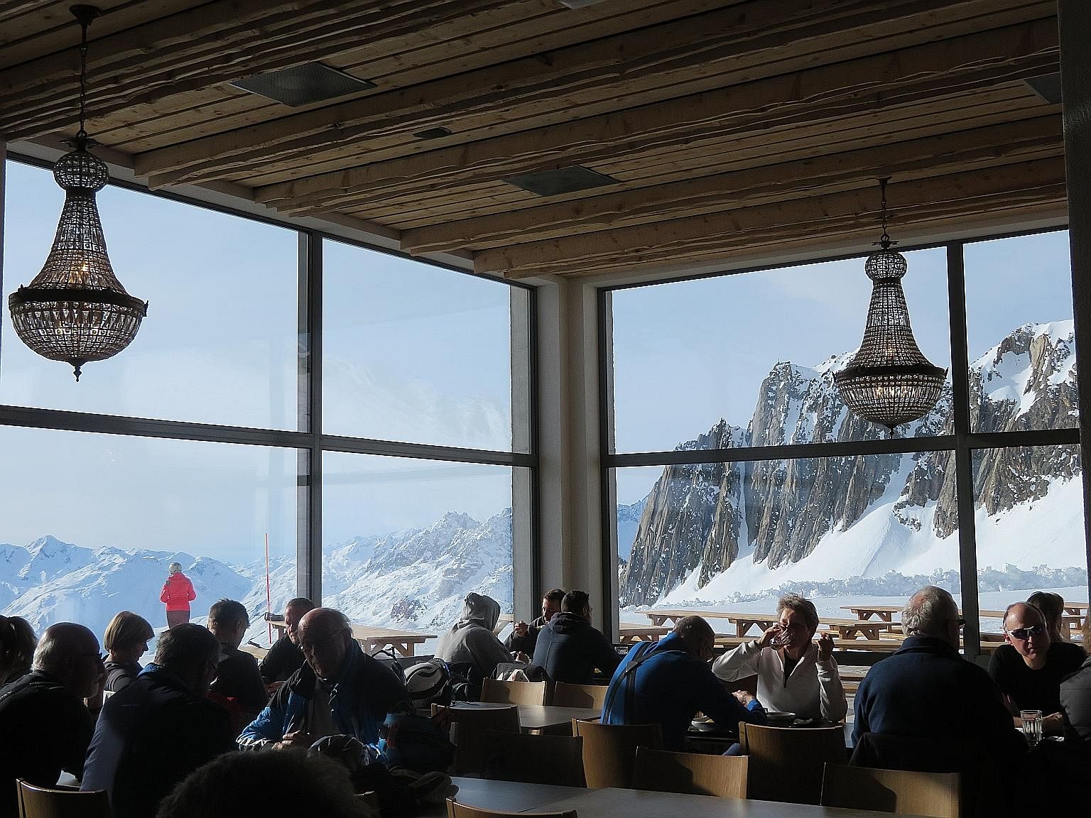 An eatery at Schneehuenerstock, where visitors can dine with a view of the sprawling Swiss Alps outside.