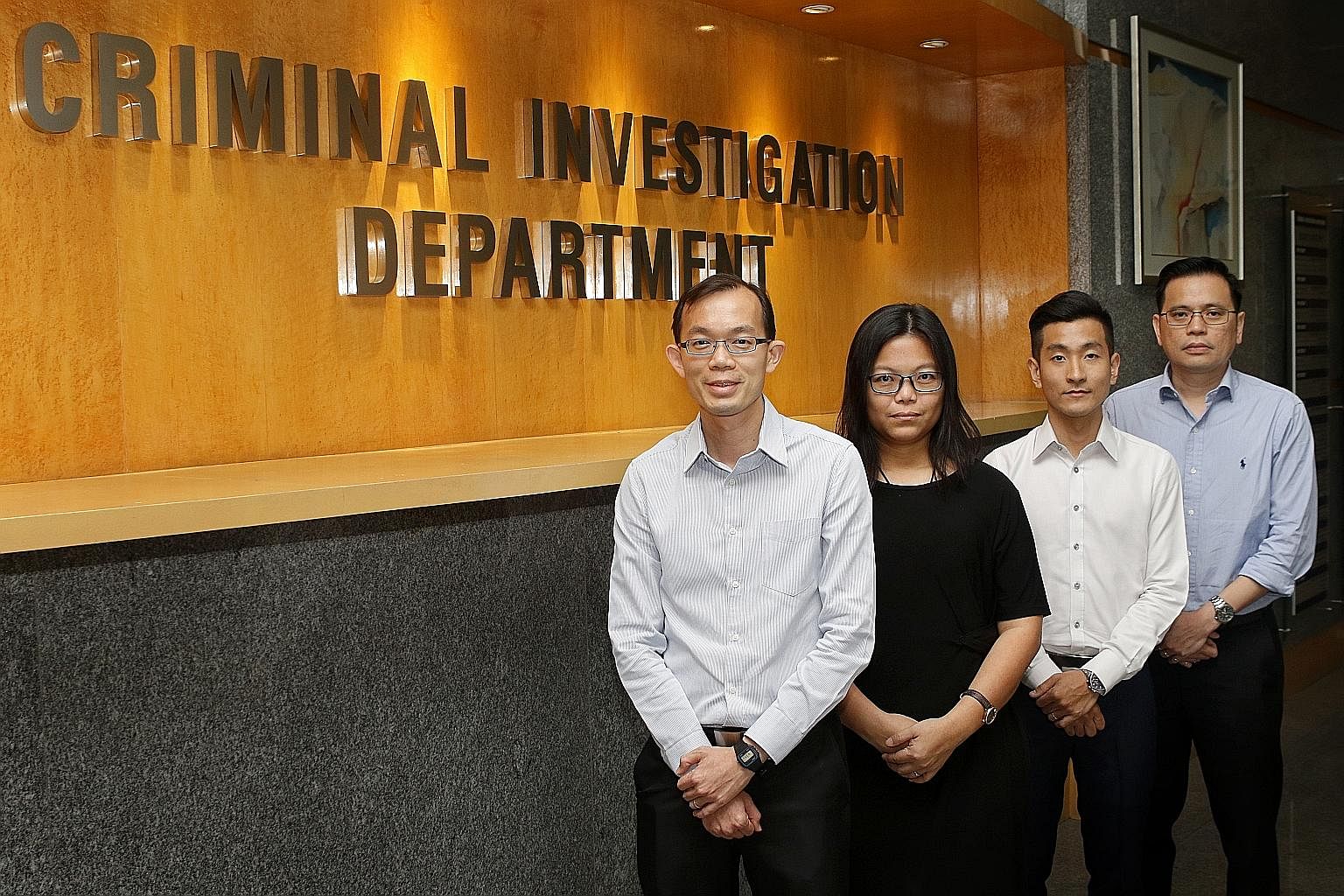 (From left) 2 Deputy Director Criminal Investigation Department (CID) and Senior Assistant Commissioner of Police Lian Ghim Hua
