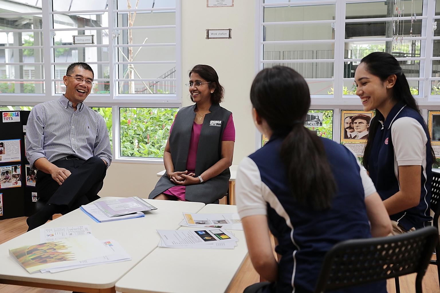 PAP Community Foundation chief executive Victor Bay with (from left) the principal of PCF Sparkletots Preschool @ Kolam Ayer Block 26B, Ms Kalamathyin; and pre-school staff. Most of the pre-school operator's Chinese language teachers, who are work pa