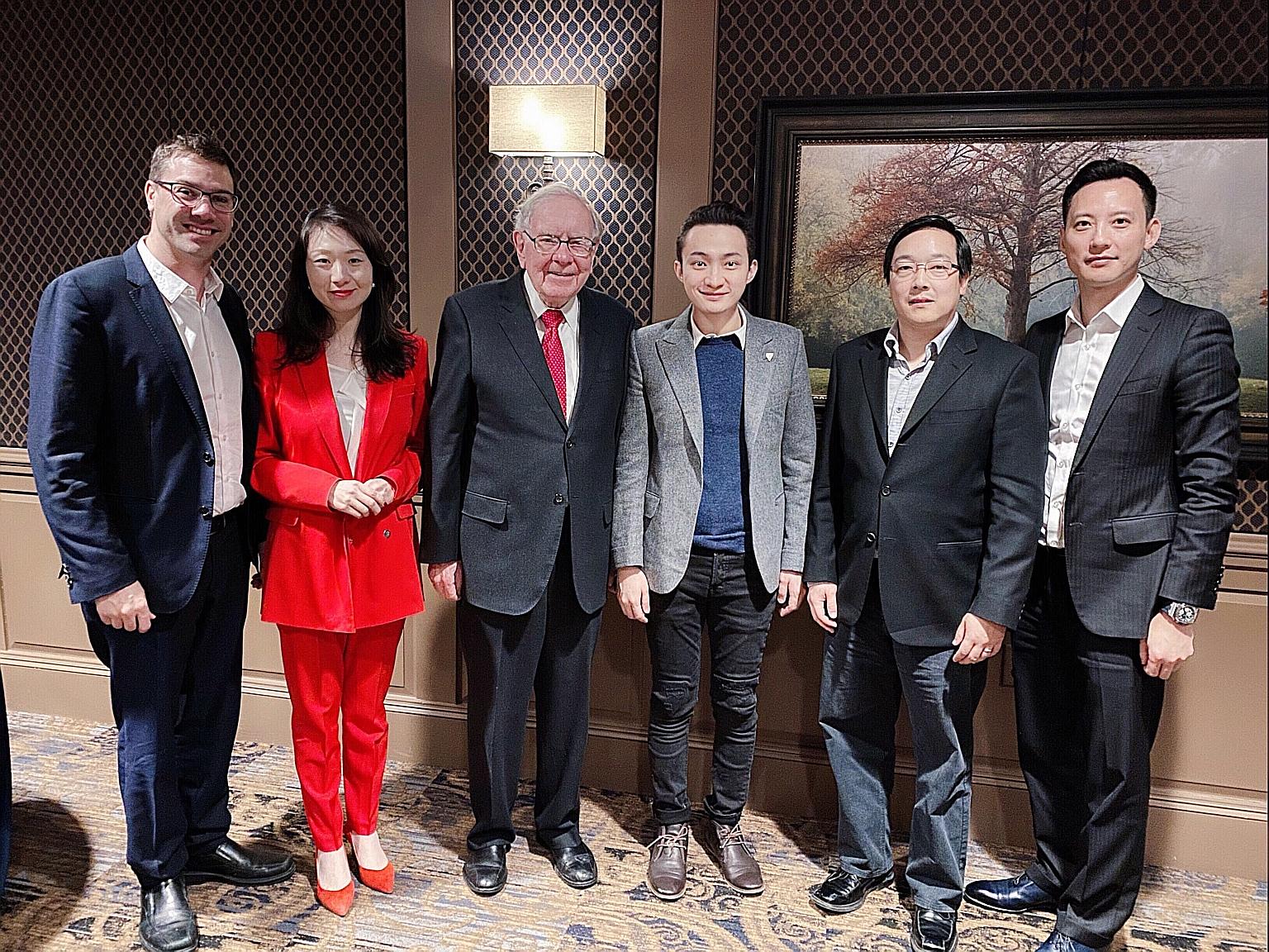 Mr Justin Sun (centre, in light grey jacket) sat down for a $6 million auctioned charity meal with investment guru Warren Buffett, along with guests (from left) Yoni Assia, Helen Hai, Charlie Lee and Chris Lee